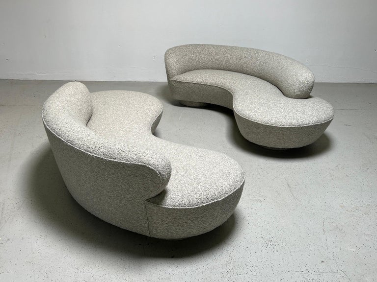 A pair of serpentine / cloud sofas designed by Vladimir Kagan for Directional. Fully restored and upholstered in Holly Hunt / Los Cabos /Steam fabric.