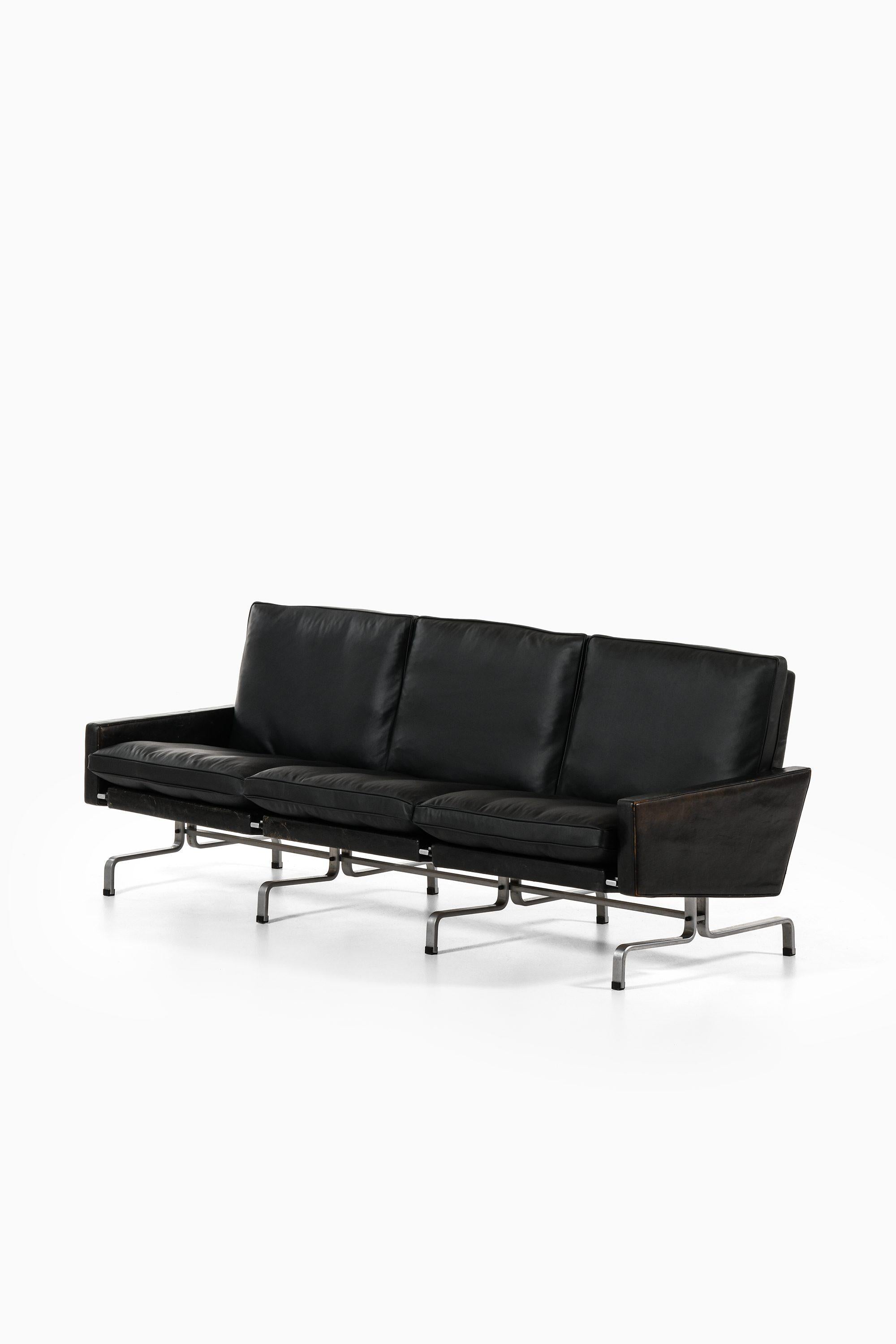 Danish Pair of Sofas in Black Leather and Flat Steel by Poul Kjærholm, 1958 For Sale