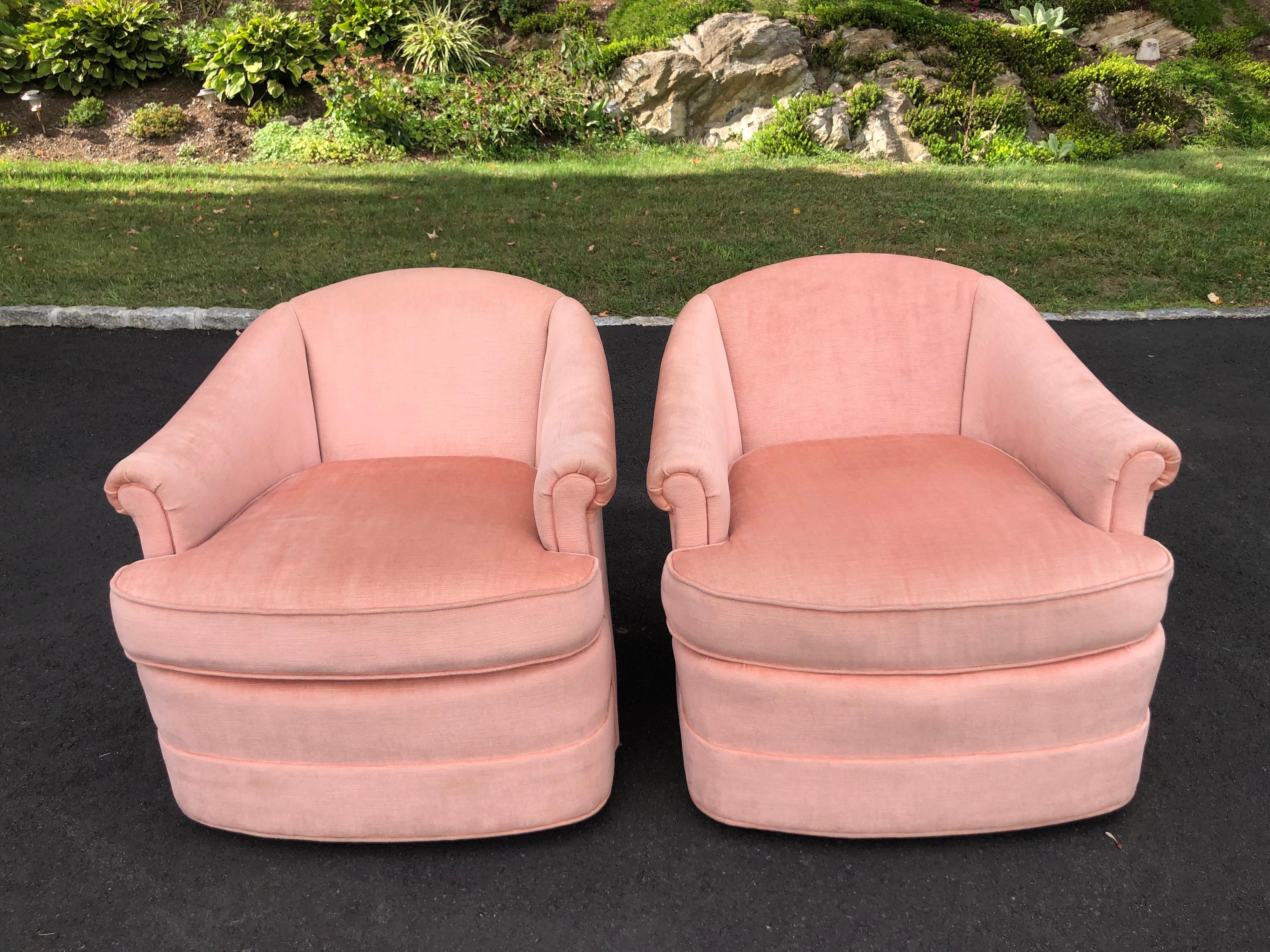 Pair of soft pink chenille swivel club chairs. Made by Thomasville. High quality and in very good, barely used ,condition. Fabulous Hollywood Regency timeless design and styling. Seat width is 21.50