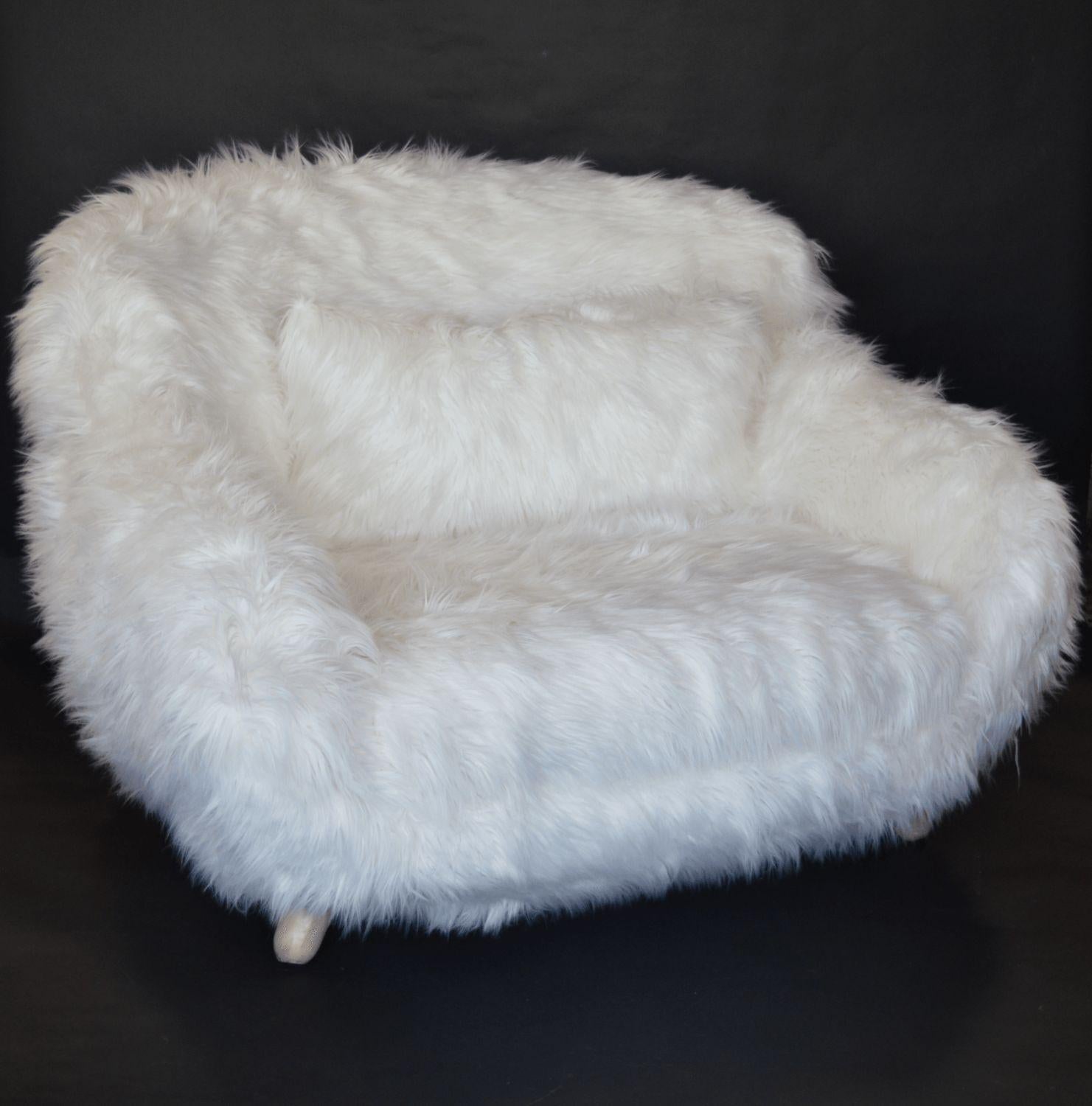 Pair of soft white oversized faux-fur arm chairs.
 
*Newly upholstered.