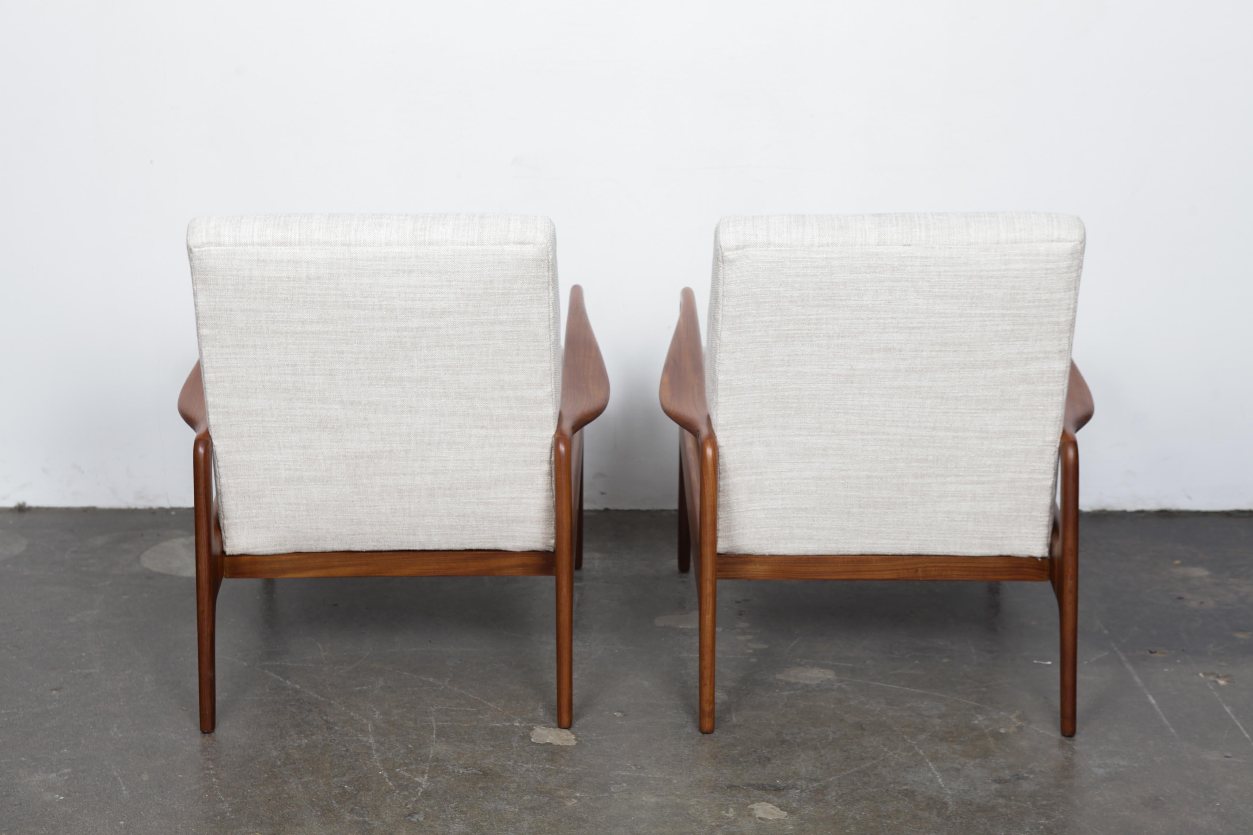 English Pair of Solid Afromoisa Teak Lounge Chairs by Greaves and Thomas, England