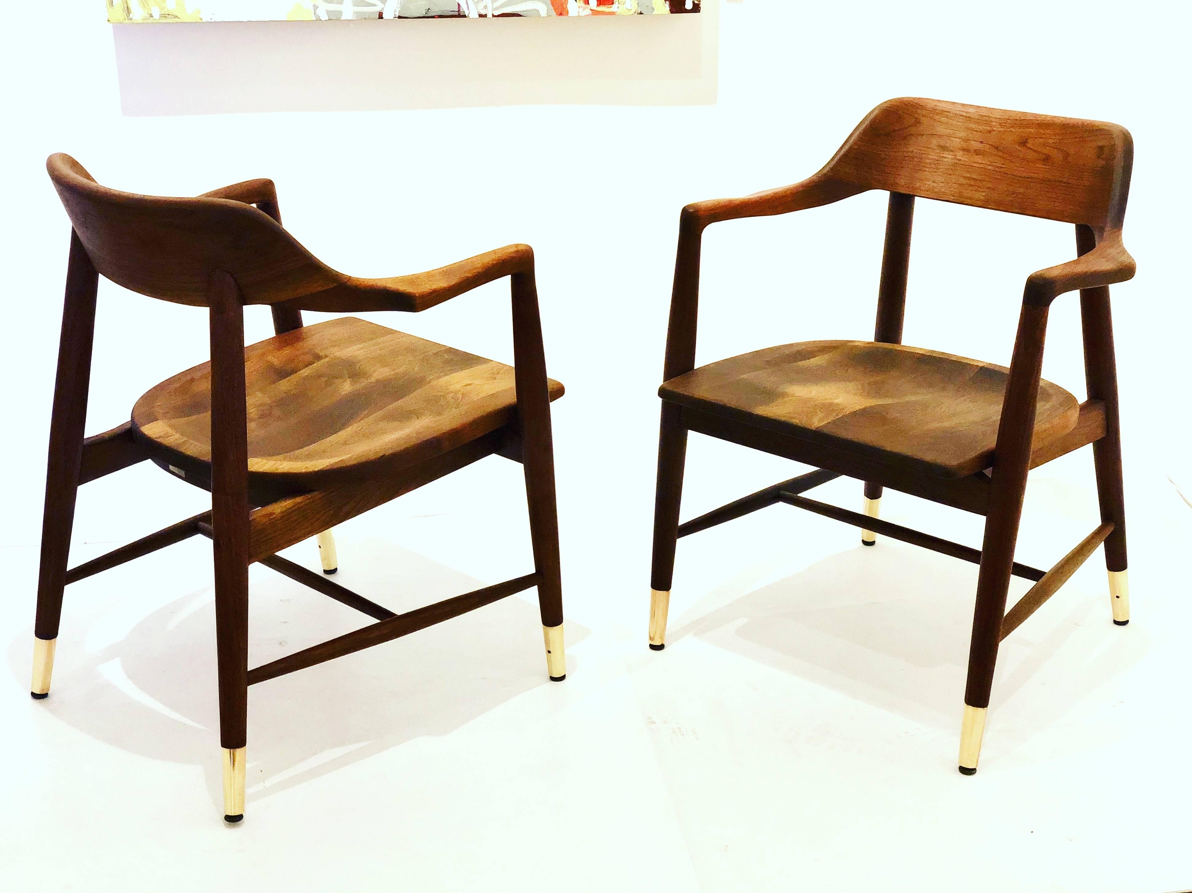 Incredible quality and craftsmanship on this pair of solid American black walnut, armchairs by Marble furniture solid and sturdy, freshly refinished and polished brass tips.