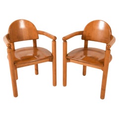 Pair of solid Beech sculptural arm chairs by Rainer Daumiller