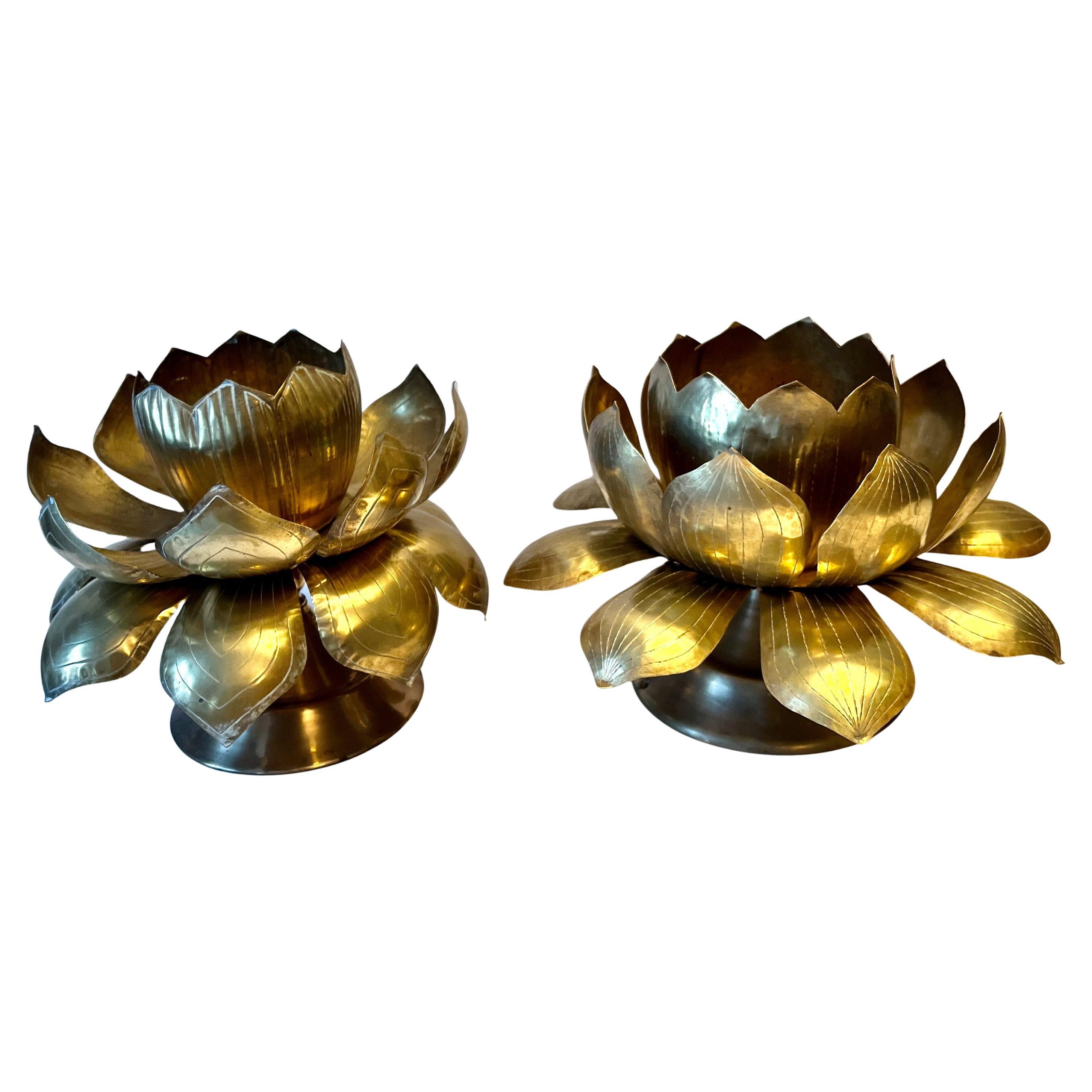 A stunning pair of solid brass lotus blossom candlesticks on stands.  

A compliment to any dining table as a centerpiece, flanking a fireplace or outdoor table, or console table.

A happy and impressive large blossom similar to the electrical