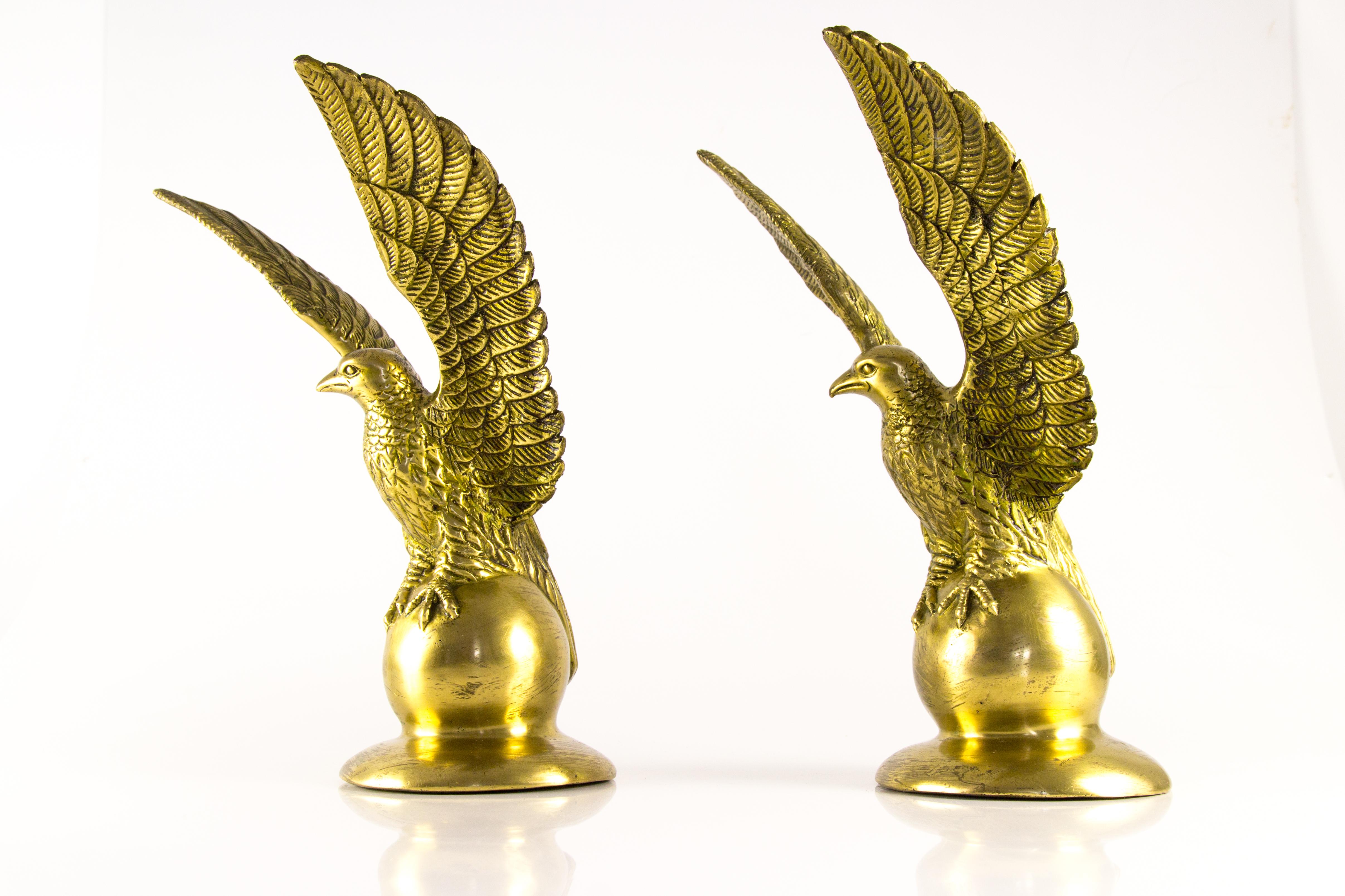 Beautiful pair of solid brass eagle statues made in France, in circa 1950s. Can be used also as bookends or will be a very decorative items on a chimney mantel.
Dimensions: diameter of base: 12.5 cm / 4.92 in; height 30 cm / 11.81 in; width 22 cm /