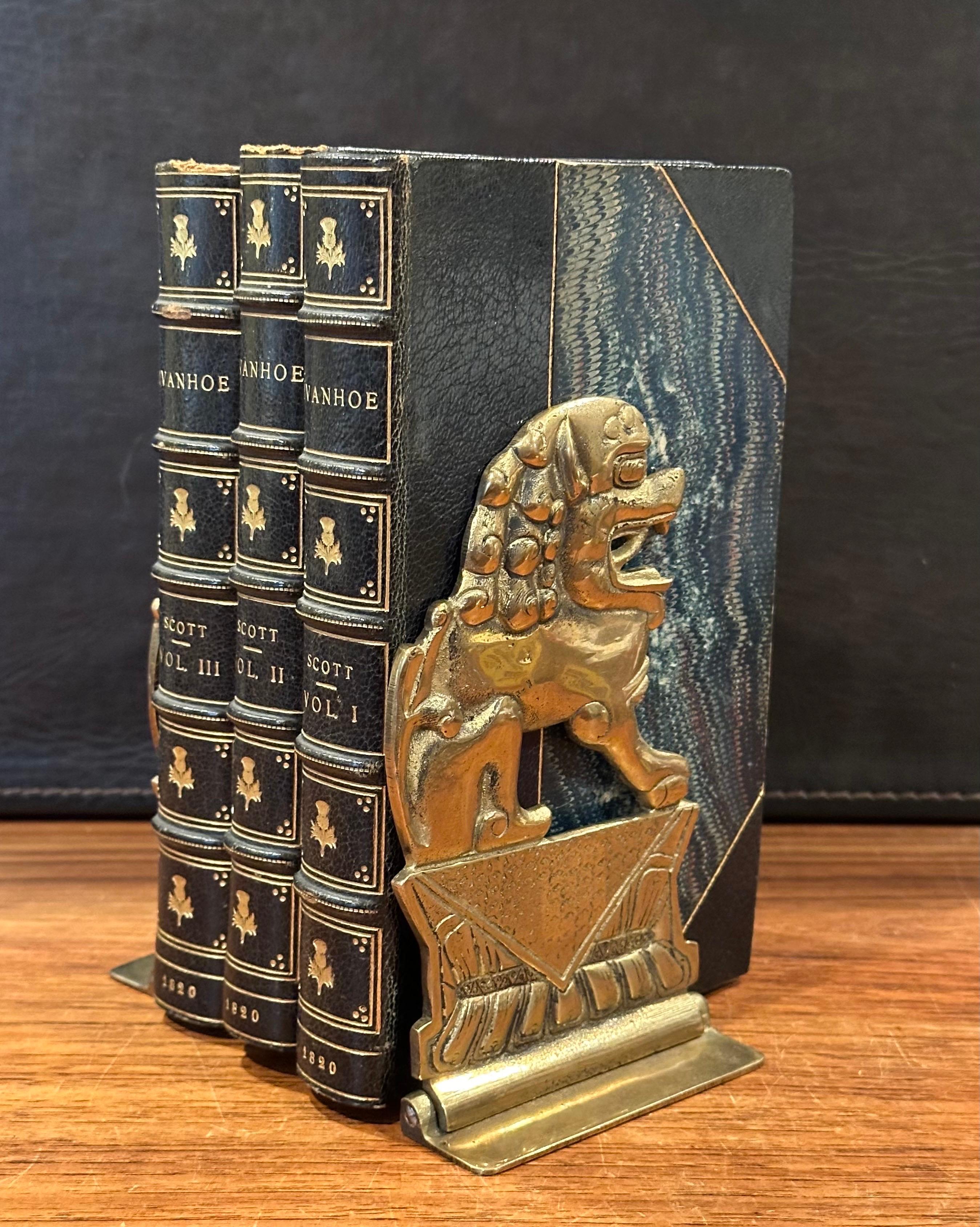 Mid-Century Modern Pair of Solid Brass Folding Chinese Foo Dog Bookends For Sale