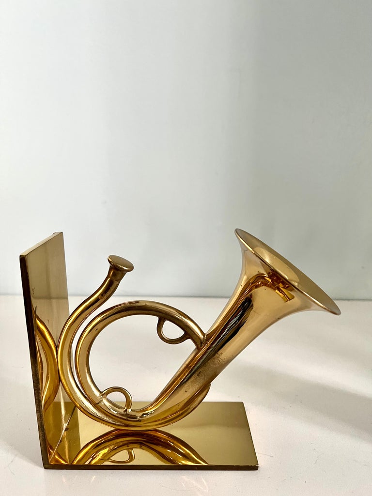 Pair of French Horn Bookends in solid polished brass. The pair are an excellent representation of a French horn - a wonderful look and compliment to any bookshelf or desk, especially those of the music aficionado. Also a lovely addition to a Childs