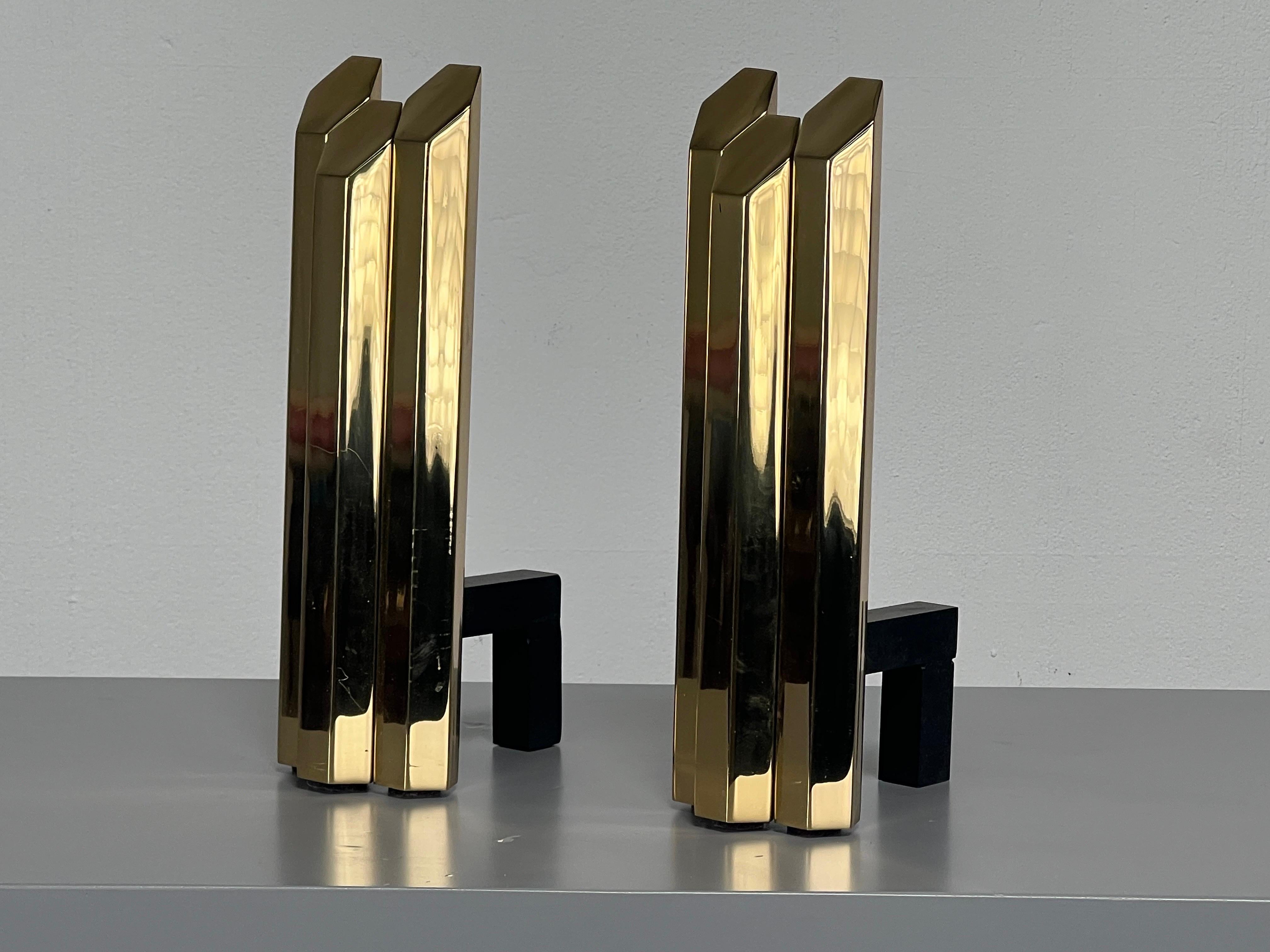 A pair of very heavy polished solid brass andirons. 