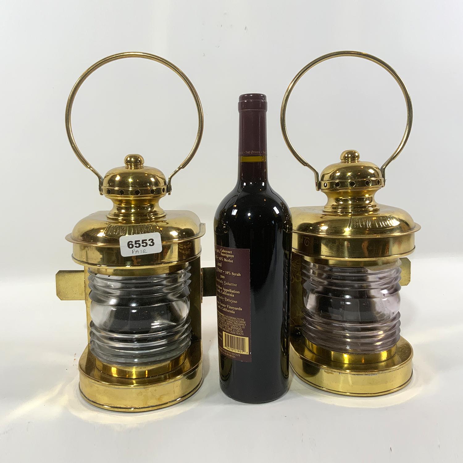 Pair of lacquered yacht lanterns with Fresnel glass lenses. Each with a brass 