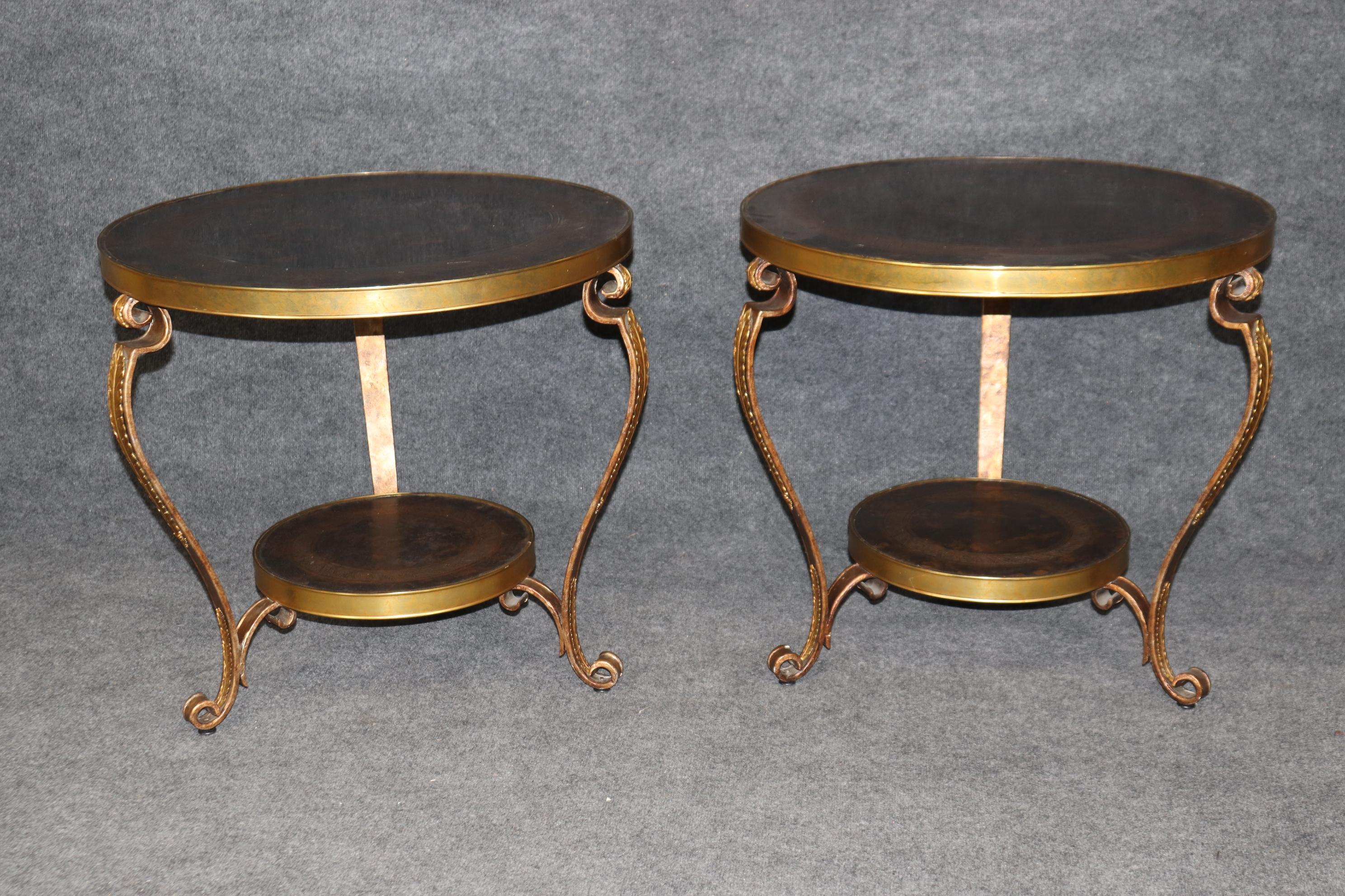 This is a gorgeous pair of gueridons with etched mottled tops with a tortoise-shell style patina applied with acid to add interest to the tops and give them an antique appearance. The tables are in good condition. They date to 1996s as indicated by