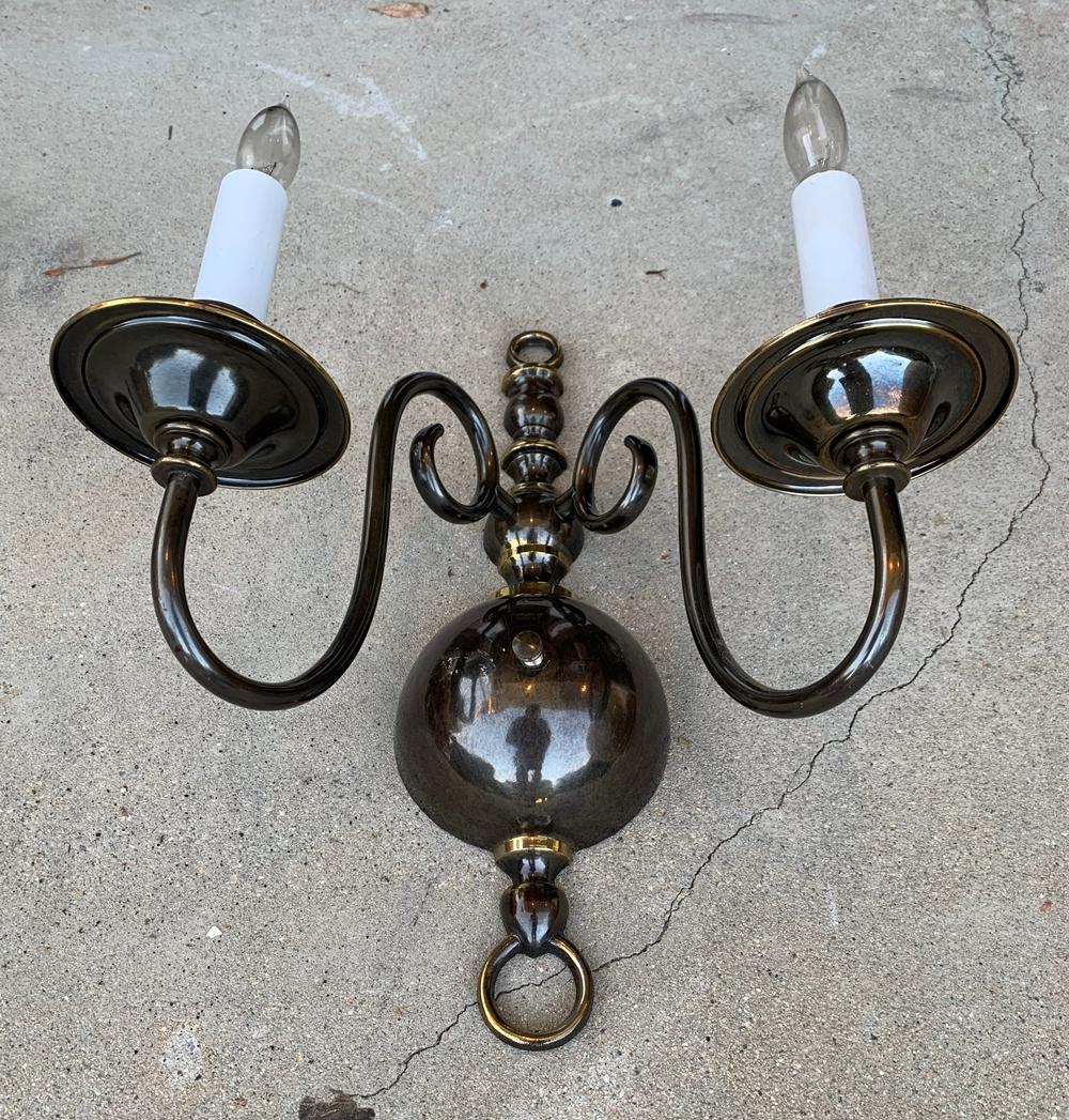 Beautiful pair of solid brass sconces made in the USA by Feldman Lighting.

The pieces are in very good condition, there were used at a church and just removed after being there since the late 1970s.

The sconces come with 2 glass shades.

The