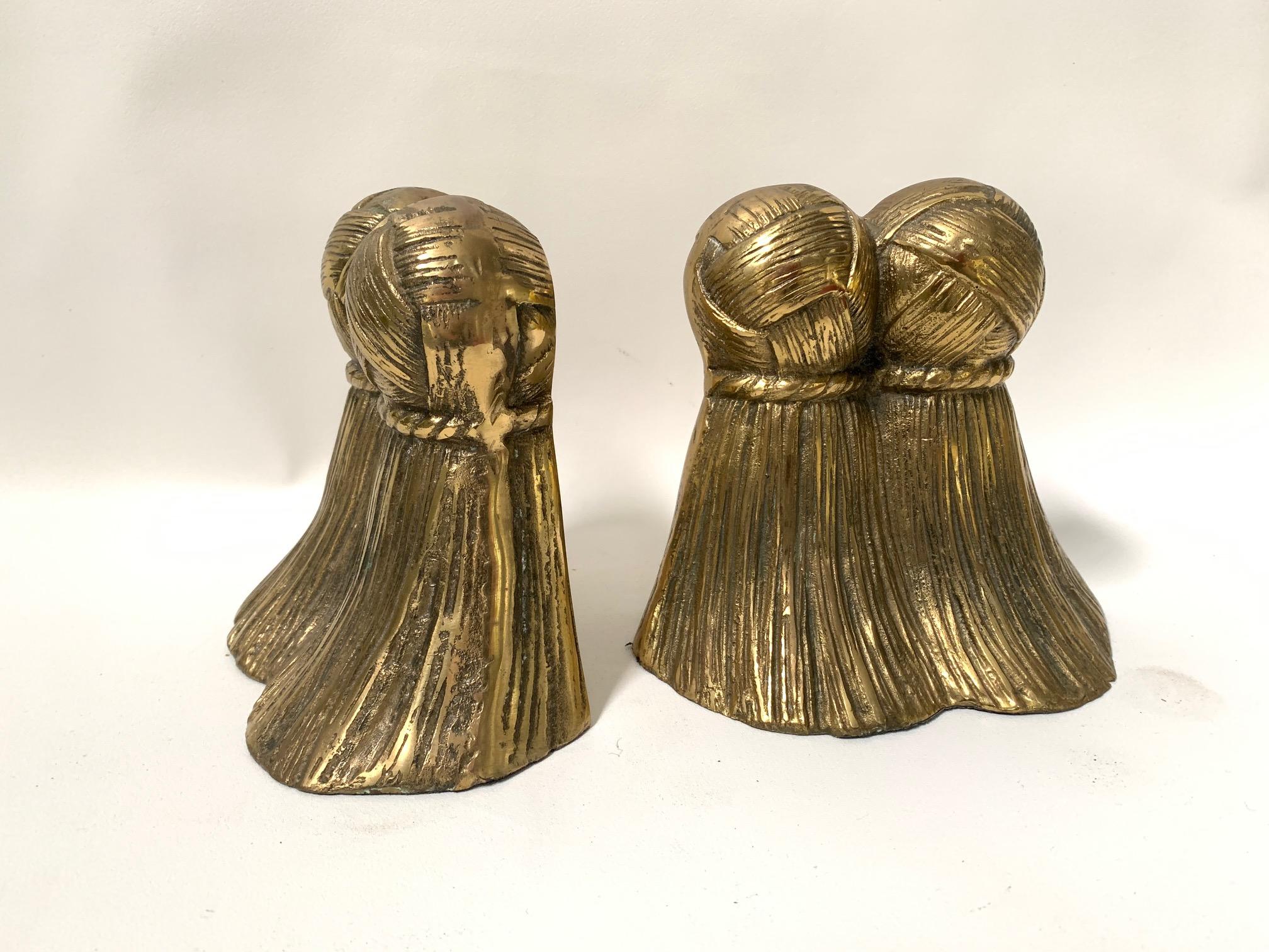 Pair of midcentury solid brass bookends formed as large tassels. Very good vintage condition.
