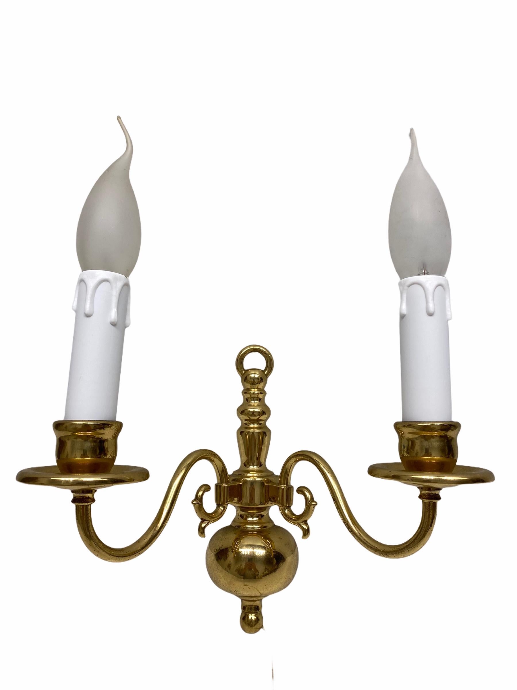 A stunning pair of heavy brass wall sconces. Each consisting of a stylish Farmhouse style design. Each fixture requires two European E14 / 110 Volt candelabra bulbs, each bulb up to 40 watts. Light bulbs shown on the pictures are not included in the