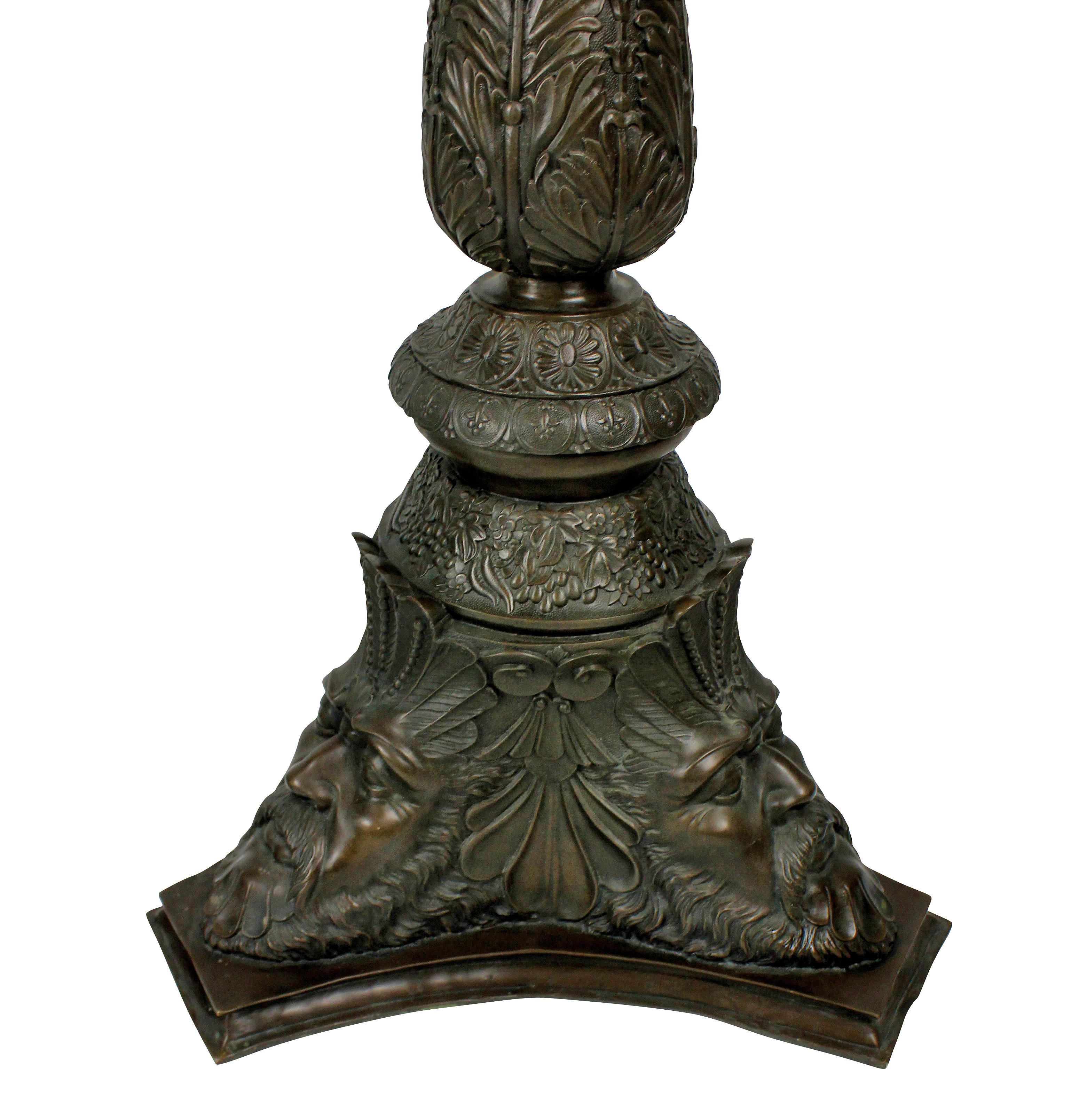A rare and beautifully cast pair of Venetian solid bronze torchere pedestals, in the Classical manner, with acanthus, anthemion and masks, with good patina.