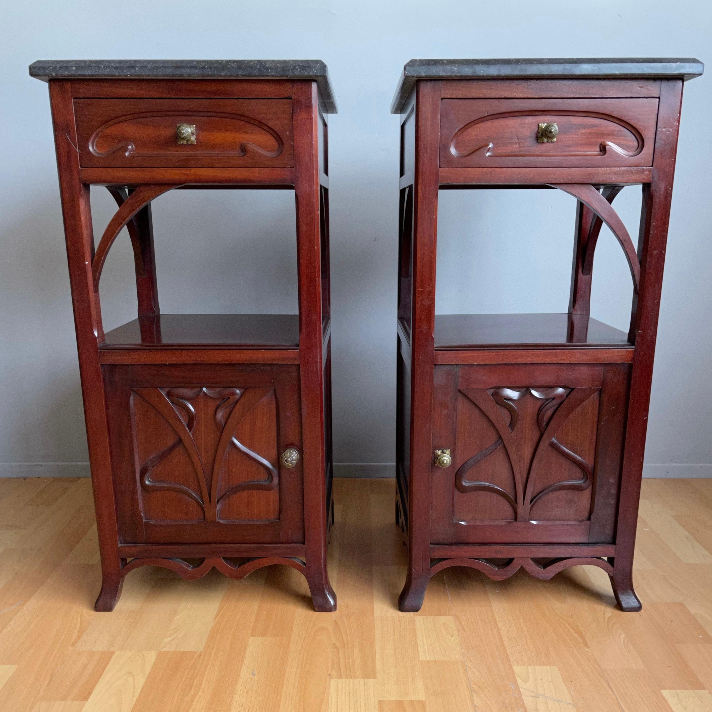 Beautiful style and good condition pair of half-open nightstands with anthracite color marble tops. 

If you are looking for aesthetically pleasing and practical to use bedside cabinets to grace your bedroom then this stylish pair could be ideal.