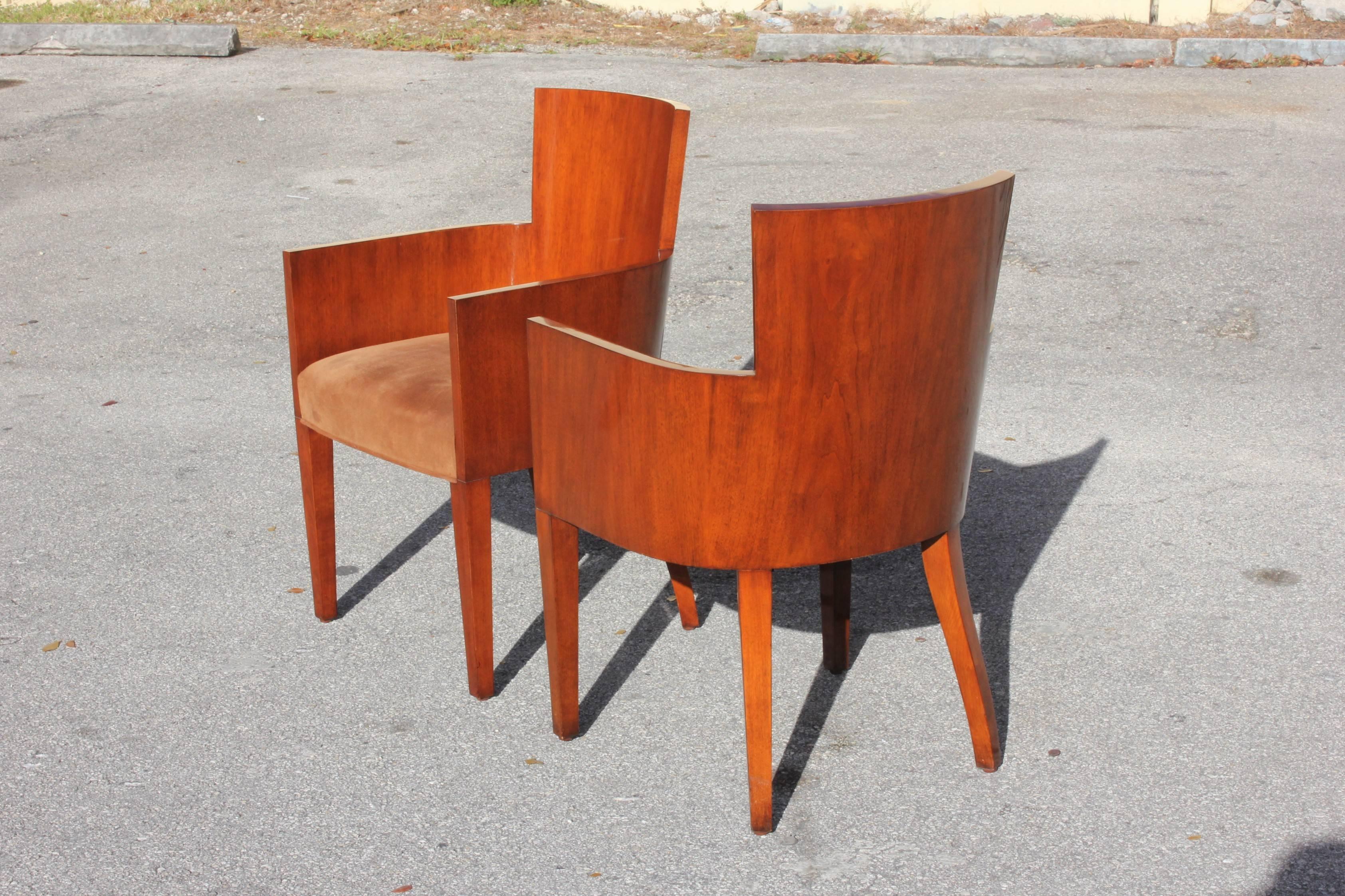 Beautiful pair of solid mahogany Ralph Lauren modern Hollywood armchairs, elegant barrel-back solid mahogany chairs with curvilinear arms and leather upholstery. Each armchair have signature brass plaque underneath, the two armchair mahogany are in