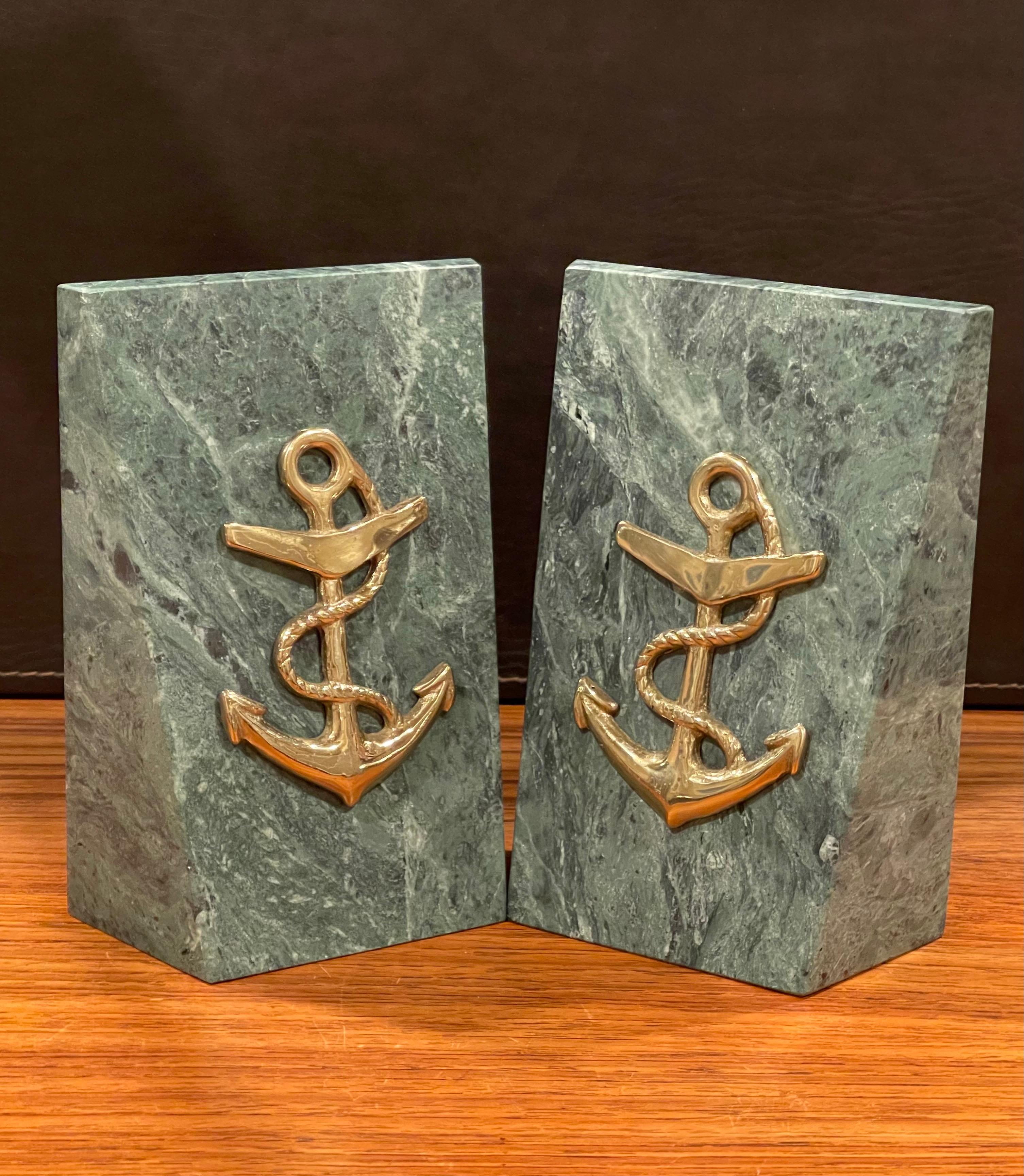 Pair of green solid marble bookends with brass anchor accent, circa 1970s. The set are in very good vintage condition with no chips or cracks and measure 5