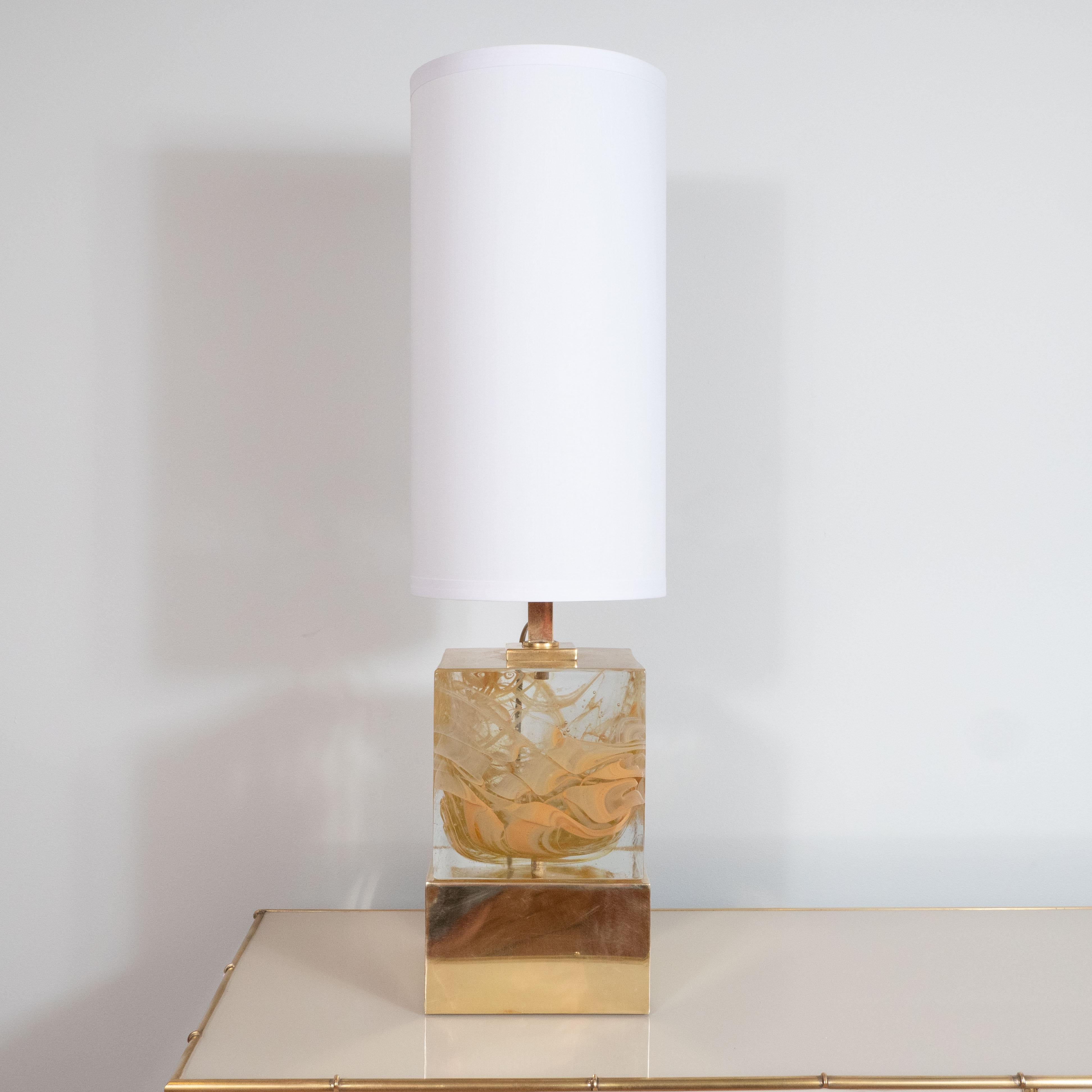 Pair of solid murano glass square cube lamps with natural brass base. Handmade in Venice using a technique that infuses natural dyes into the glass as it is cast to produce a swirl effect, giving it an almost a jeweled rock look. Predominant colors