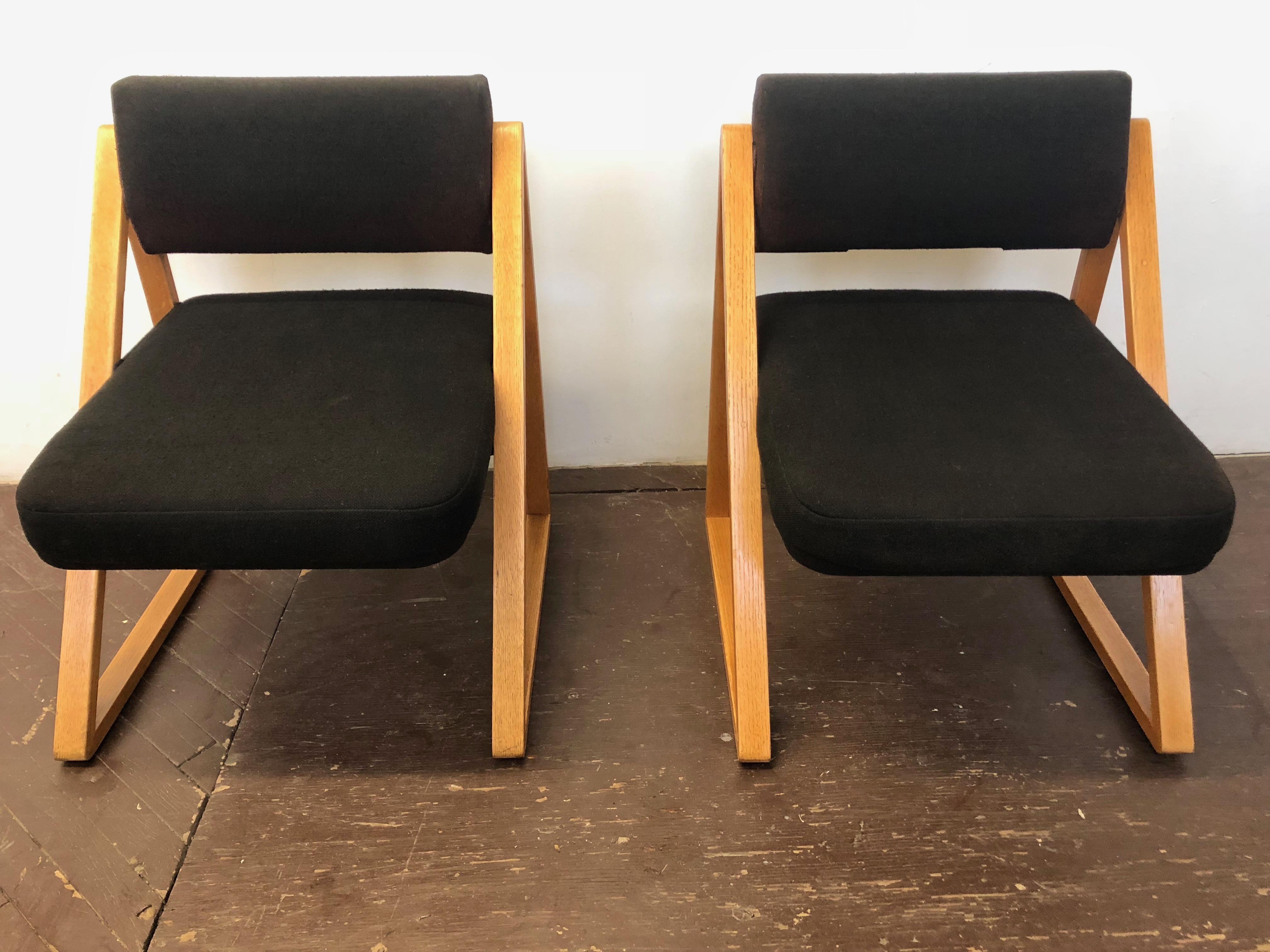 Pair of French modernist lounge or side chairs with wool fabric upholstery and solid oak triangular frames.