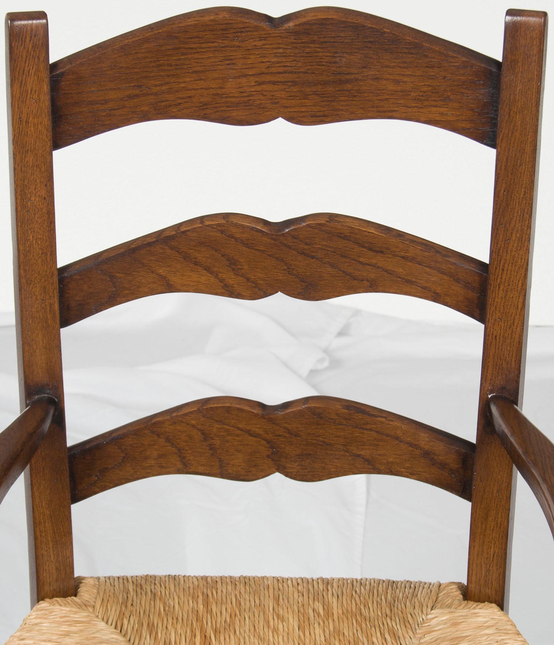 English Pair of Solid Oak Rush Seat Ladder Back Dining Room Armchairs For Sale