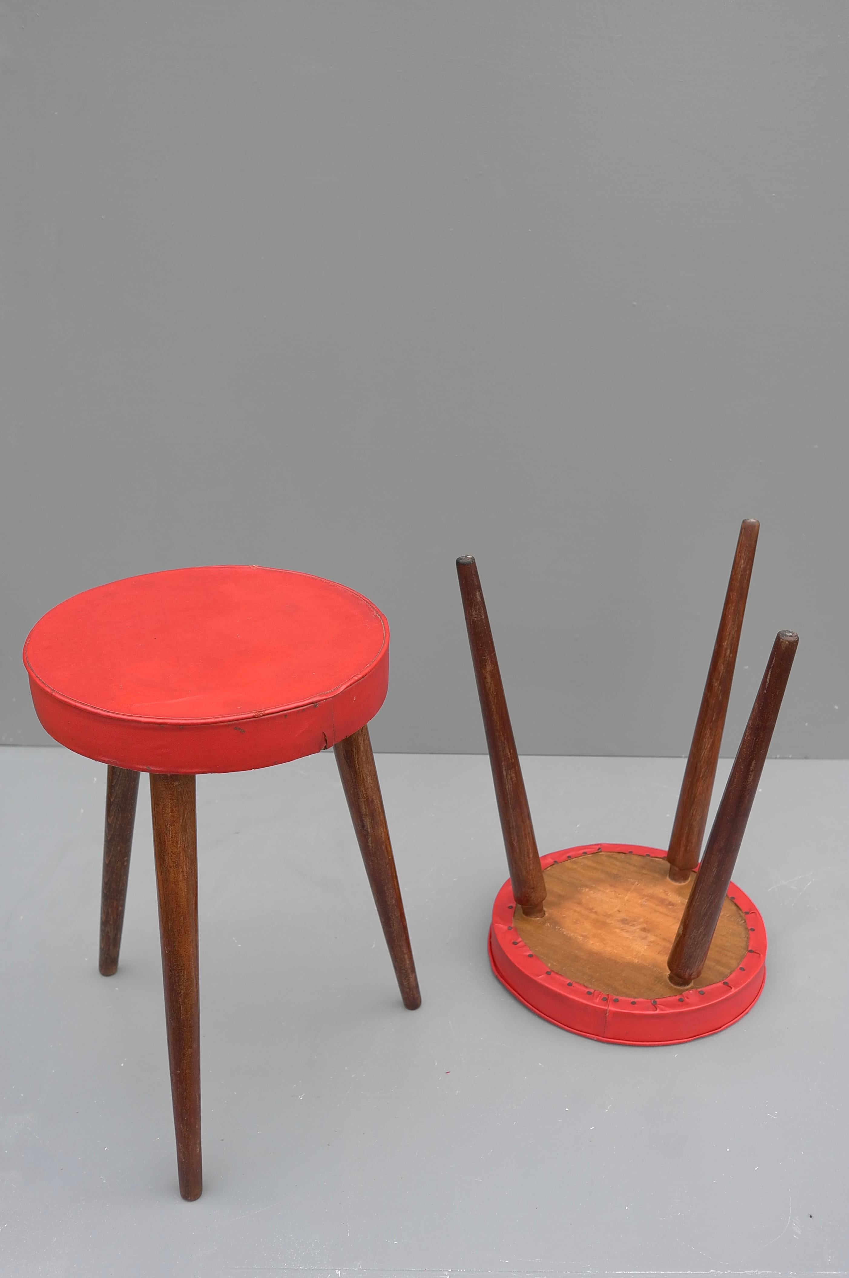 Mid-Century Modern Pair of Solid Oak Stools with Red Vinyl Seats, France, 1960's For Sale