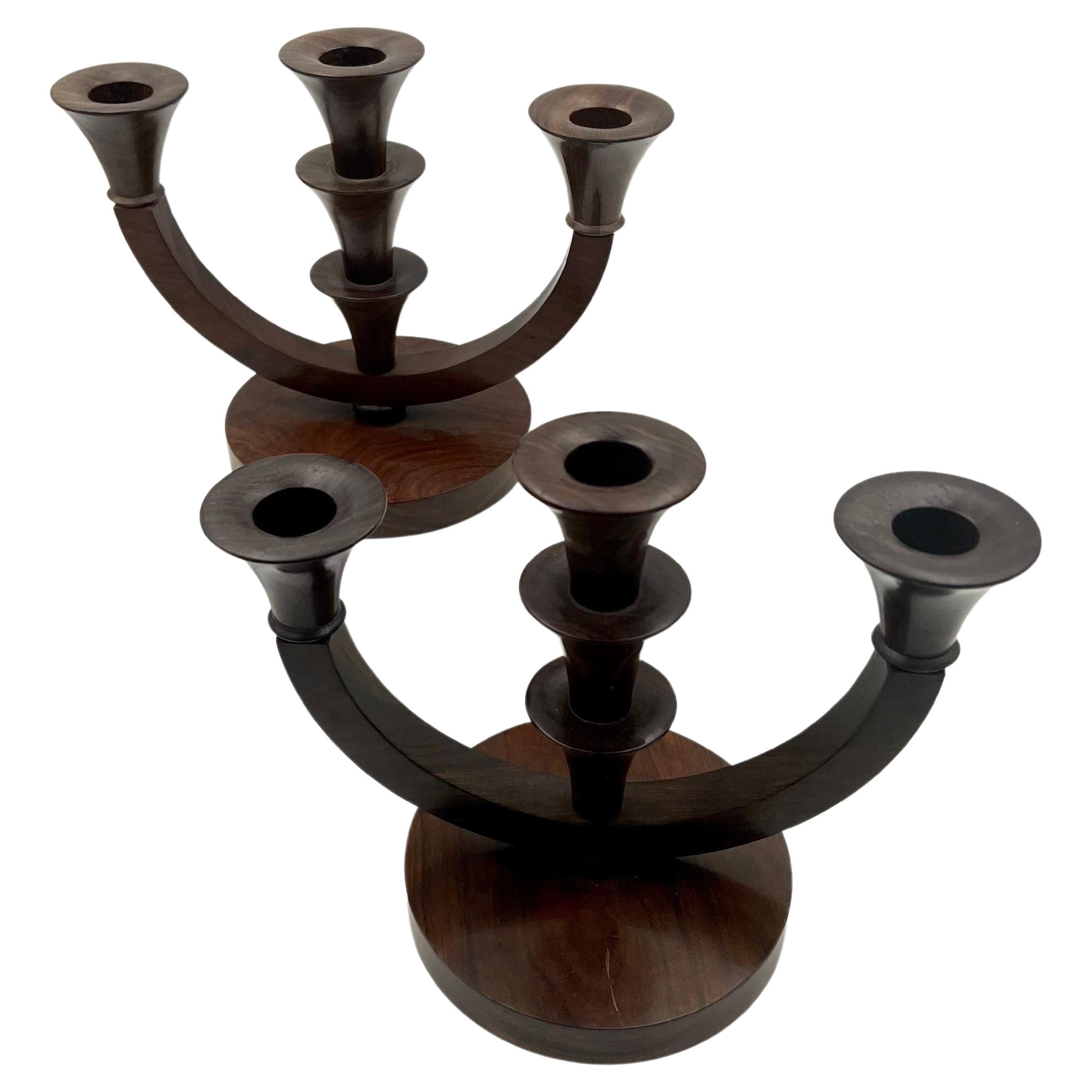 Beautiful pair of solid olive tree wood, with walnut stain candle holders made in Africa, circa 1970s.