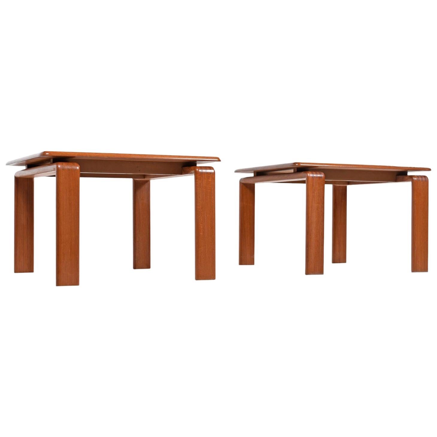 Pair of solid teak vintage Danish modern end tables. Planks of solid teak are laid together to create one slab tabletop. Legs are beautifully contoured solid teak with exposed finger joints at the crook. Tabletop appears to float over the legs