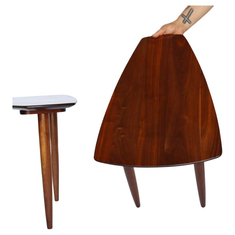 Beautiful pair of solid walnut (not veneer) side tables by Ace-Hi. These are dated 1962 under each table. They feature a beautiful tapered edge and a warm walnut. Each table stands on three slender solid walnut legs. Some of the photos and video