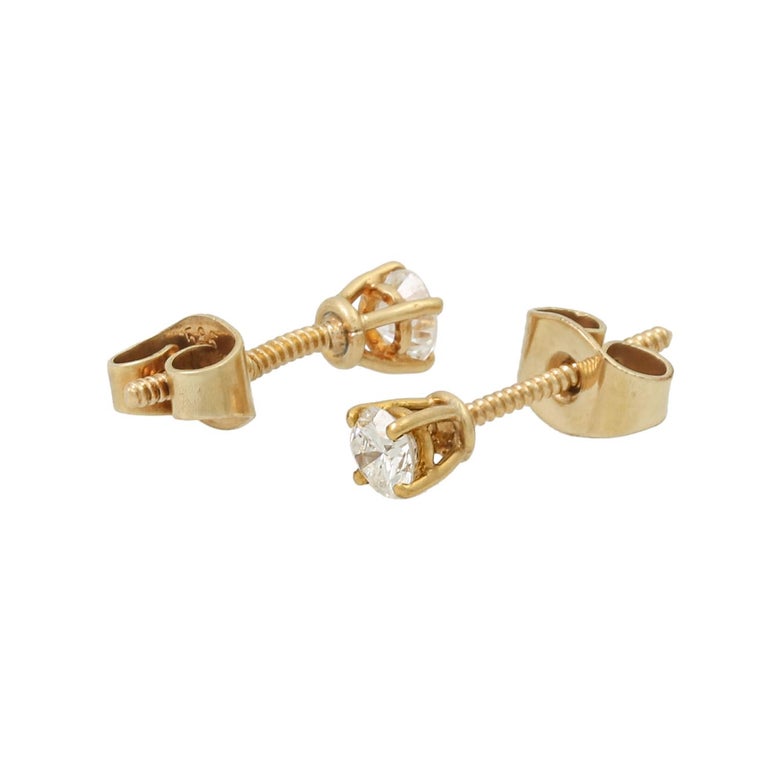 Pair of solitaire stud earrings with diamonds For Sale at 1stDibs