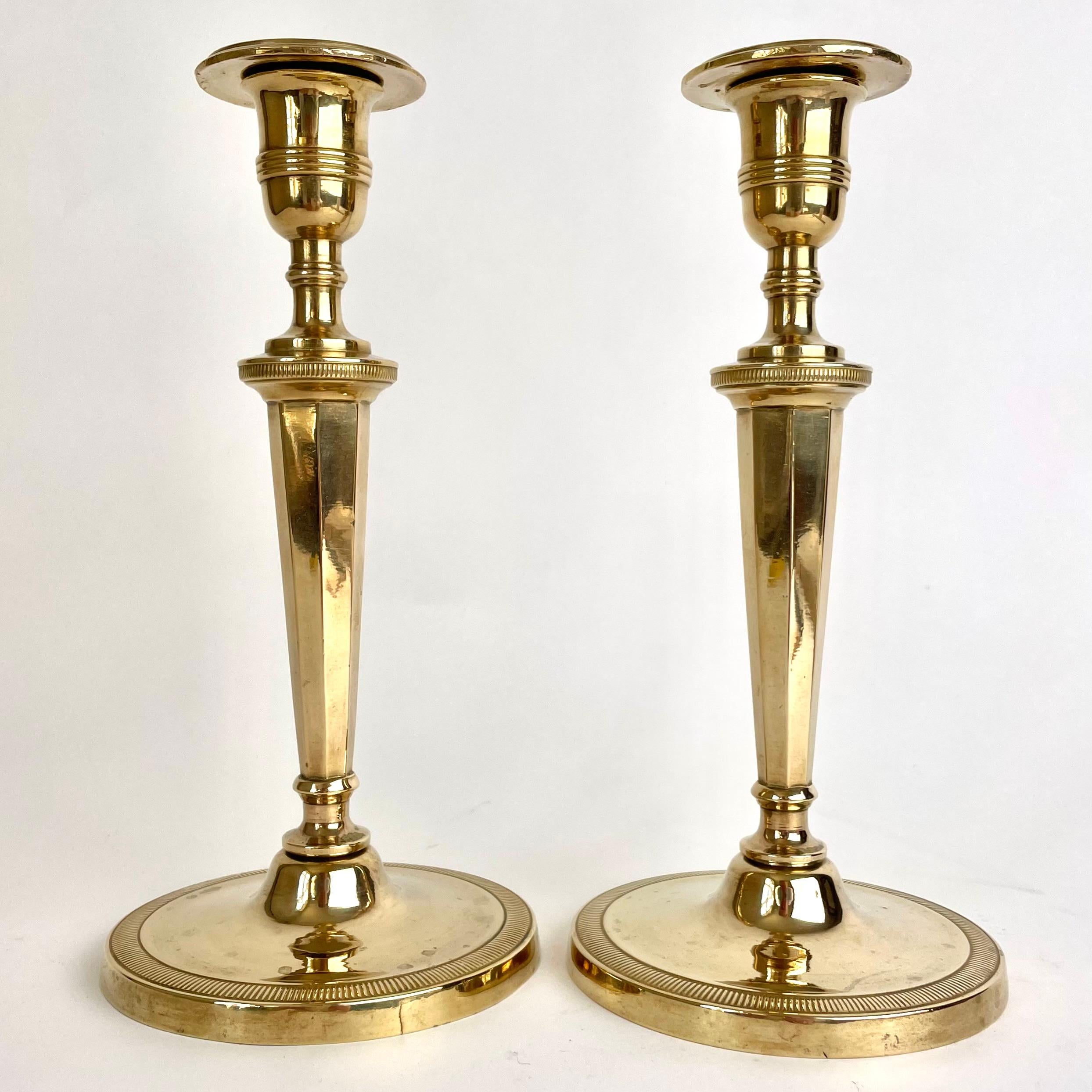 A pair of sophisticated and elegant gilt bronze Candlesticks, Probably made in Paris, France. Directoire circa 1795.

Wear consistent with age and use.