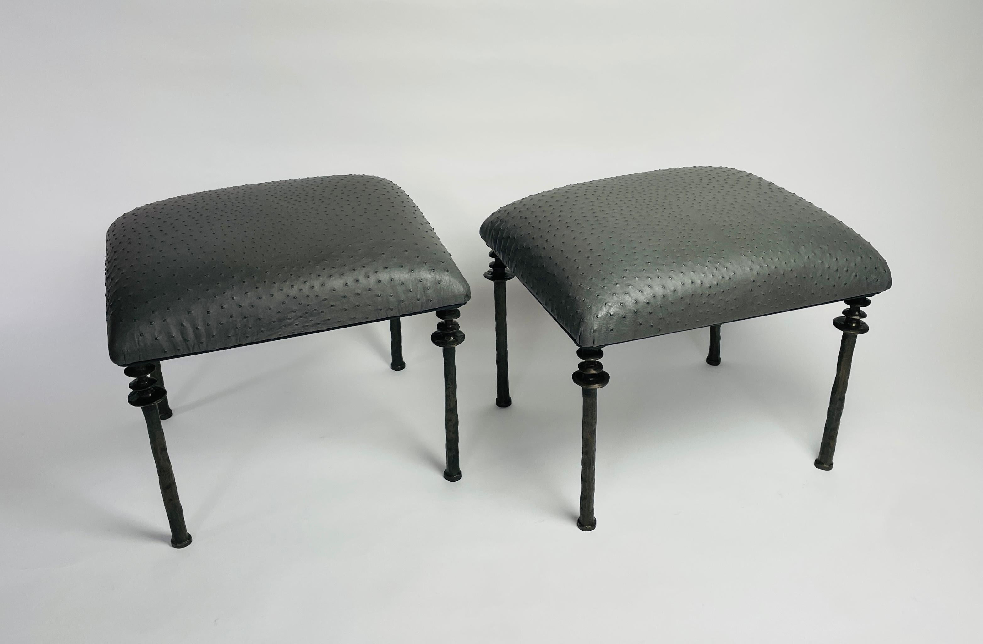 Two beautiful stools inspired by Diego Giacometti, these stools are ideal for those who are looking for unique seating. Their cast bronze legs provide a truly organic touch. The seat cushion has been upholstered in an anthracite farmed ostrich