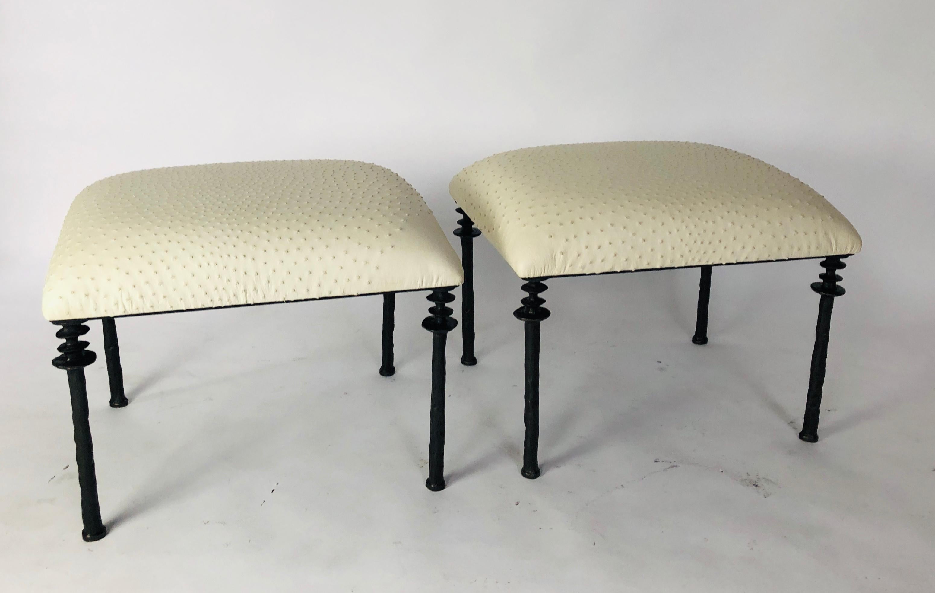 Two beautiful stools inspired by Diego Giacometti, these stools are ideal for those who are looking for unique seating. Their cast bronze legs provide a truly organic touch. The seat cushion has been upholstered in a tan ostrich leather hide.