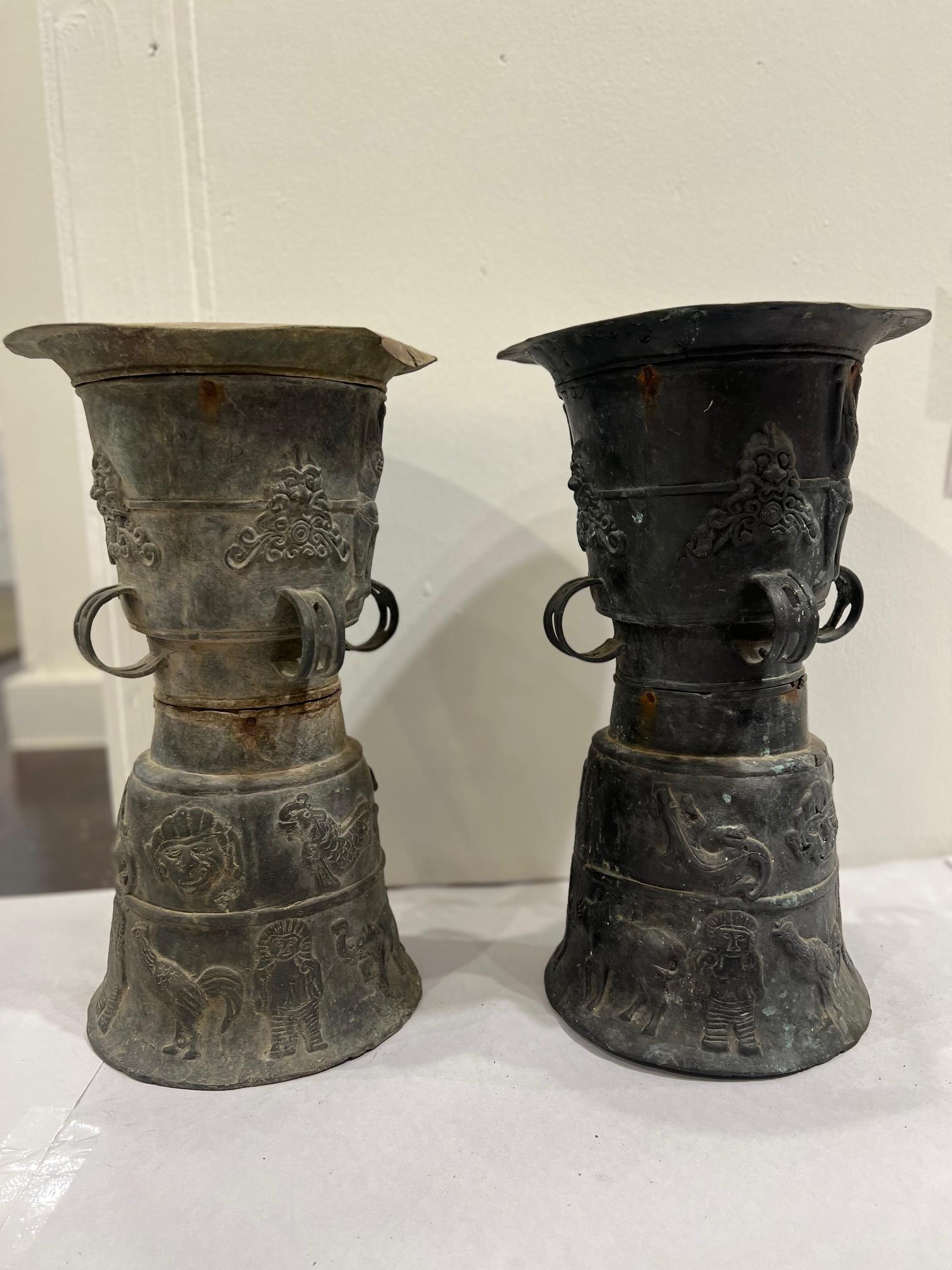 Pair of Southeast Asian ceremonial rain drums. Estimated that the bronze drums dates to the early 19th century. The top surface is adorned with a ceremonial star and tops are not that level, as shown in the photos. Imperfections as shown but they