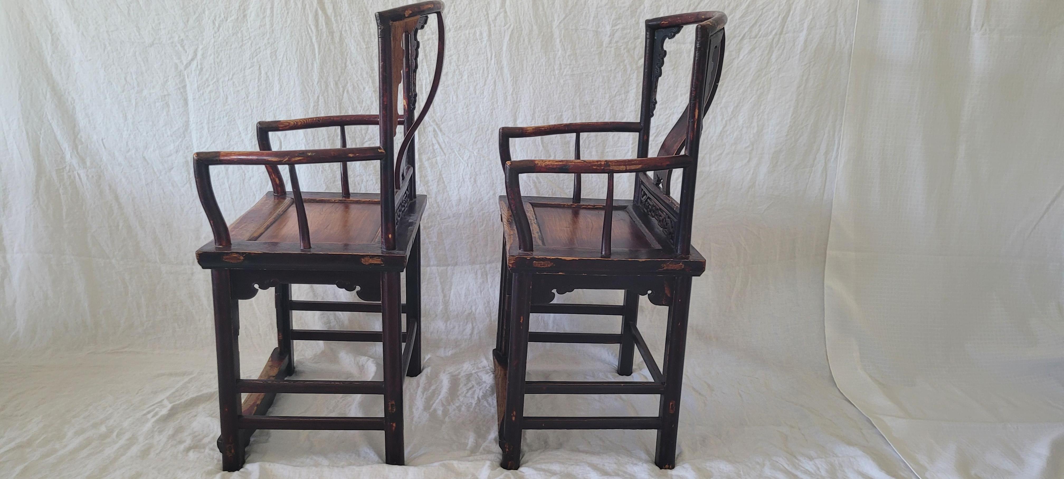 Pair of  Southern Official’s Hat Armchairs	41h x 22w x 17d
This style of chair is also called “Wen Yi” which literally means scholars chairs.  The main feature of this pair is a high seat indicating that this pair had once a foot rest to go along