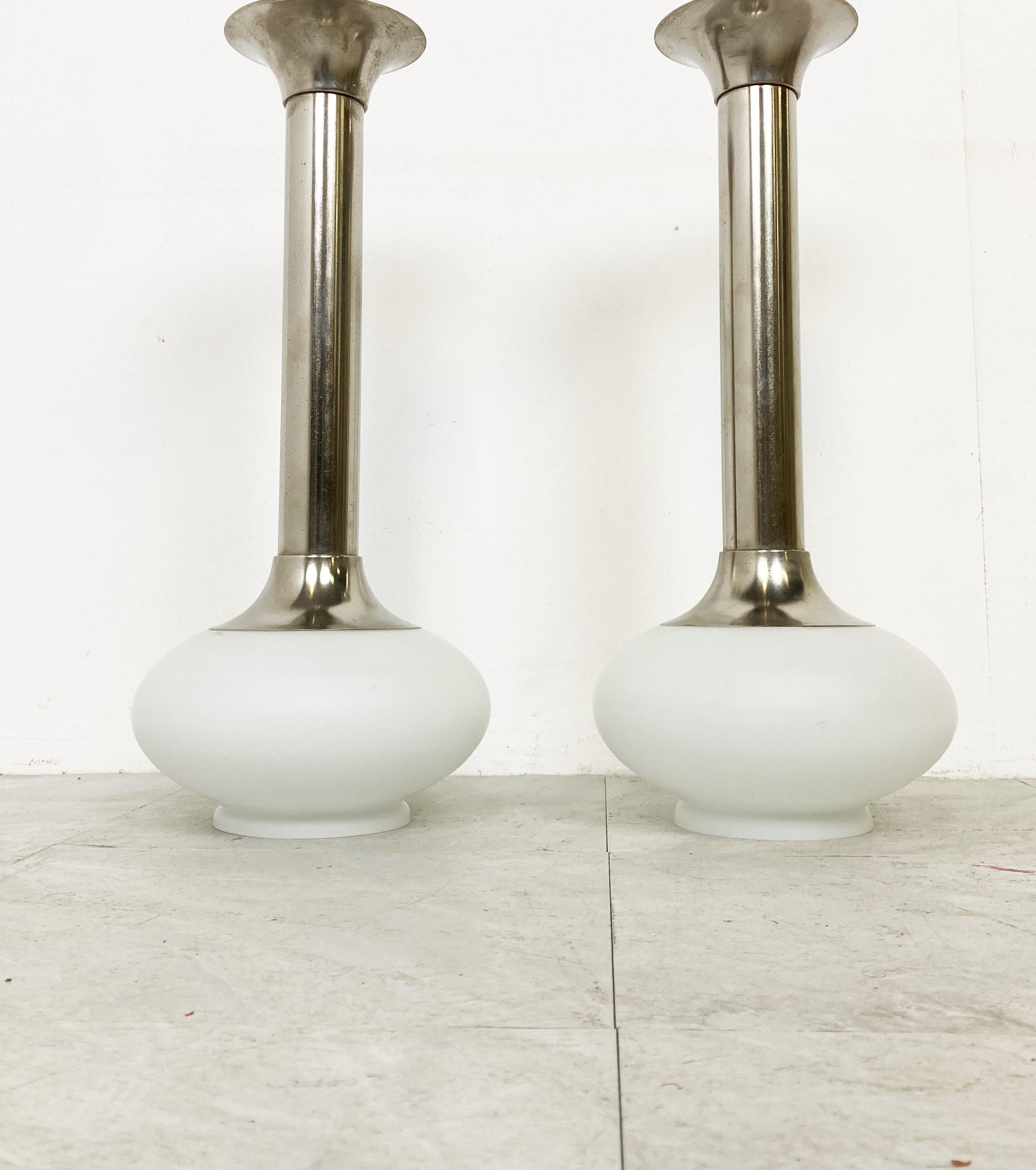 Pair of chromed and opal glass ceiling lights by VEB NARVA from Germany.

Cool space age design with a soft dimmed light thanks to the opal shades.

1970s - Germany

Dimensions:
Height: 51cm/20.07