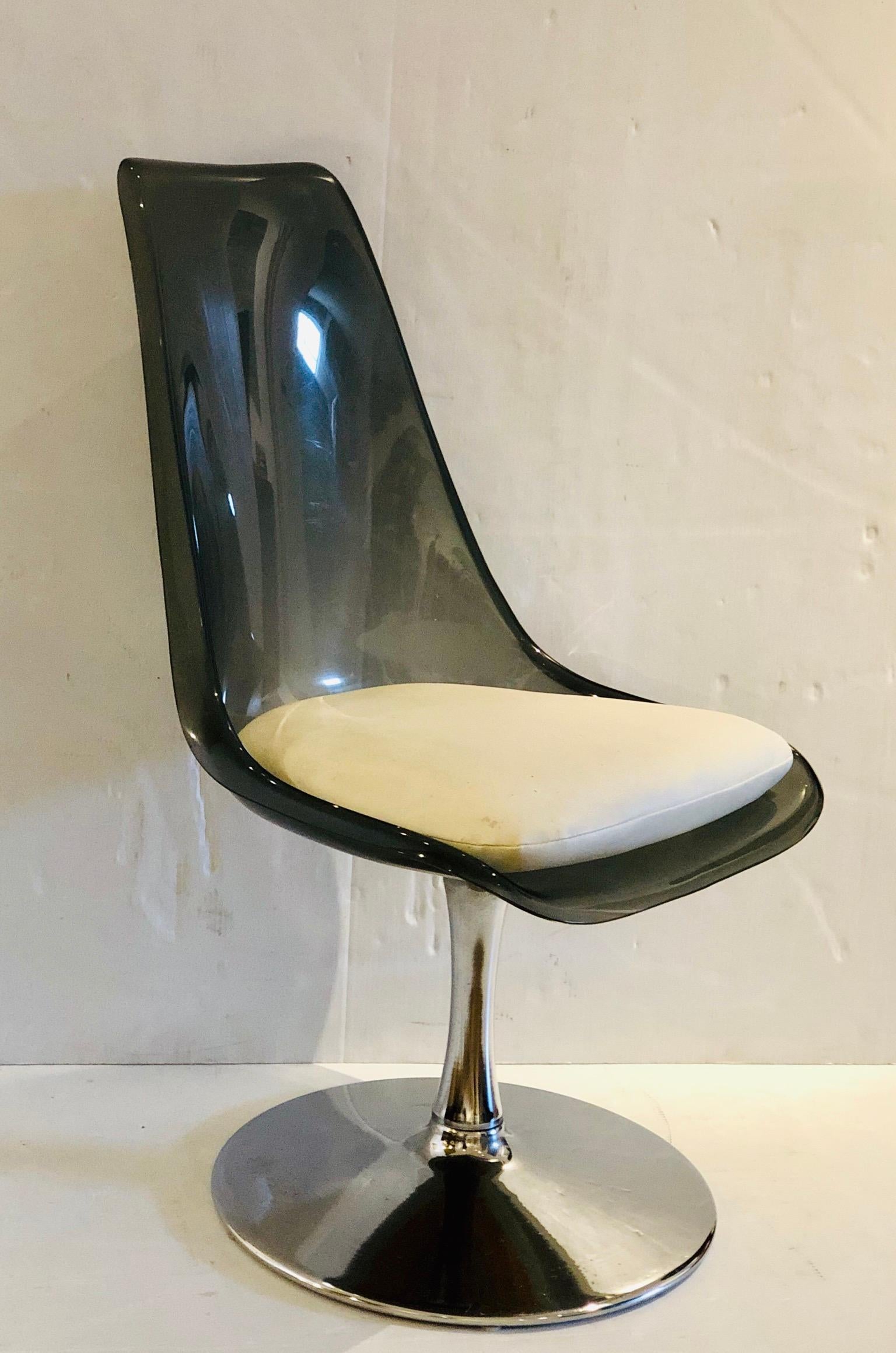 Beautiful pair of chairs in smoke Lucite top and swivel chrome base, these chairs are from the 1970s, made by Chrome craft, we have polished the base and the Lucite retains its original Naugahyde seats in white, the seats can be recovered to a