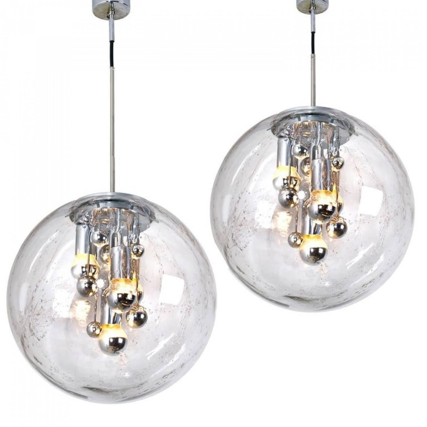 We offer an amazing and unique pair of large Space Age light fixture. The set was made by the German manufacturer Doria in the 1970s.

These heavy quality light sculptures not only function as light sources but also as a sculptural components. To