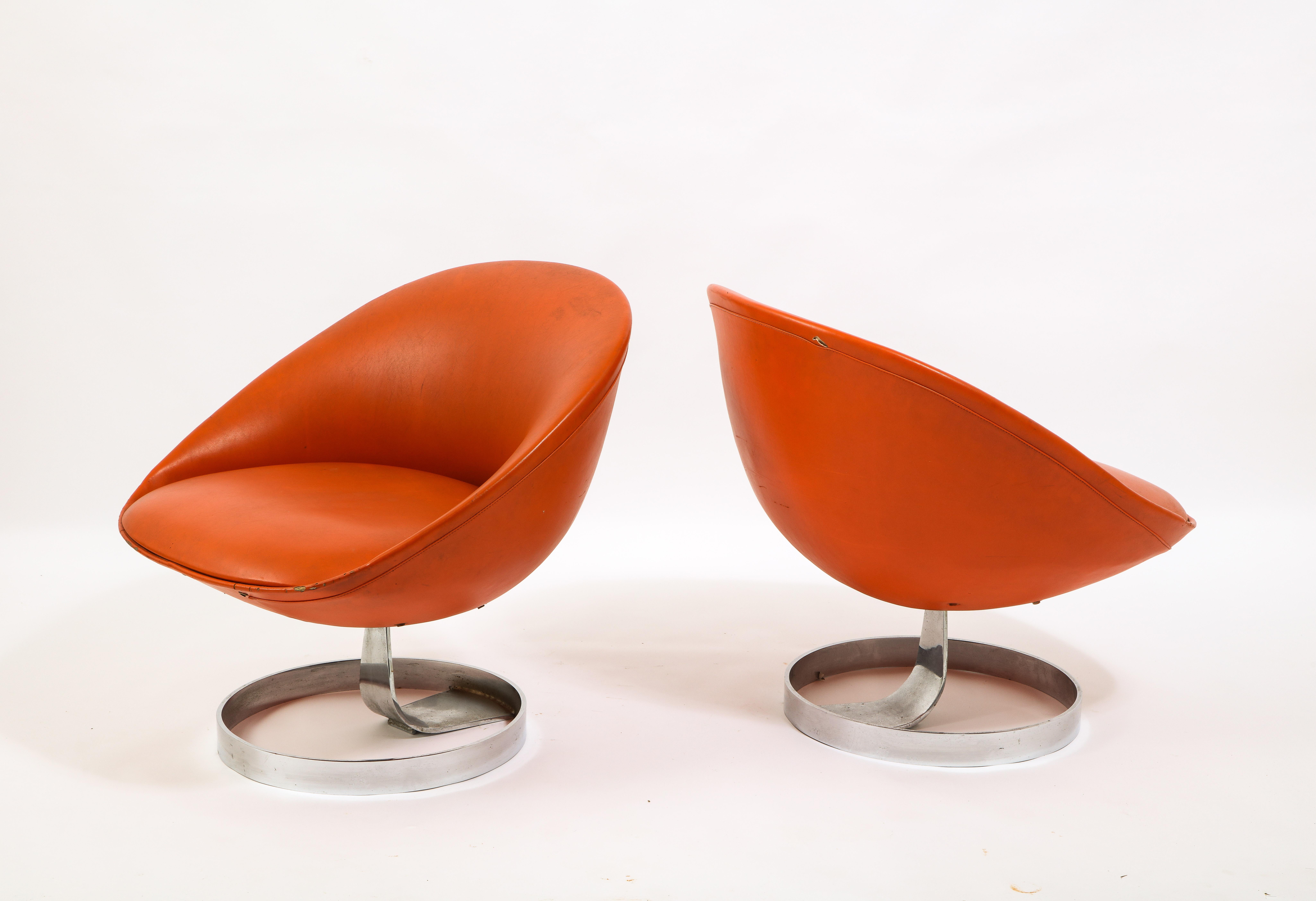 Rare pair of K1 lounge chairs for Alpha Industries. Maurice Calka is well known for his outlandish fiberglass boomerang desks, but this pair of chairs is a perfect example of his creativity. The shell is formed aluminum resting on a chrome-plated