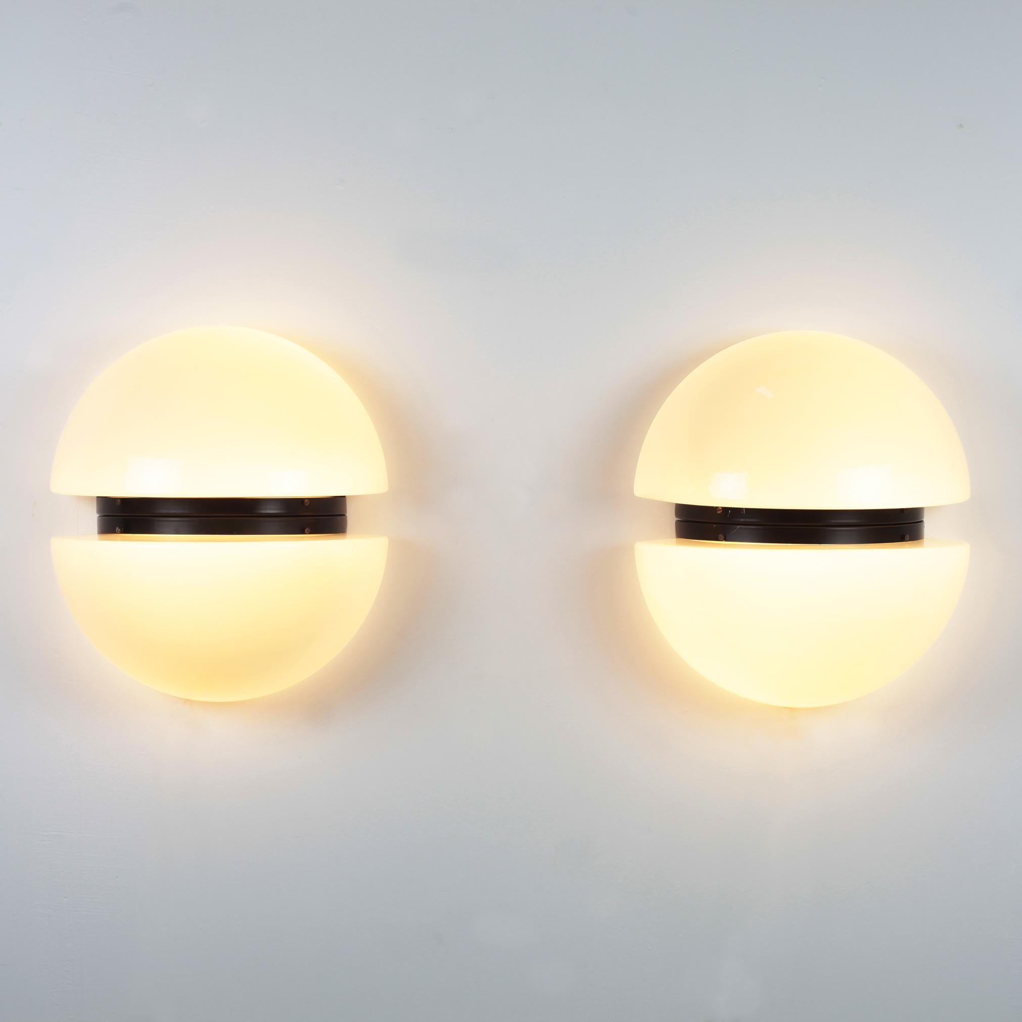 Pair of huge black metal and opaline glass Space Age wall light by RAAK, Netherlands, 1970.