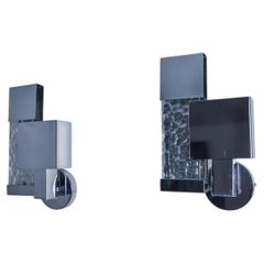 Pair of Space-age sconces, chromed metal and cut glass, Italy, 1980