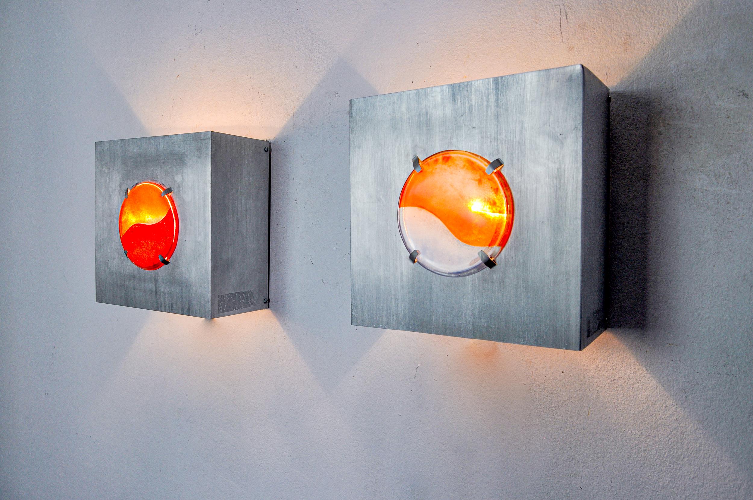Very nice pair of space age wall lights designed and produced in Germany in the 1970s. These wall lights are made of a round 