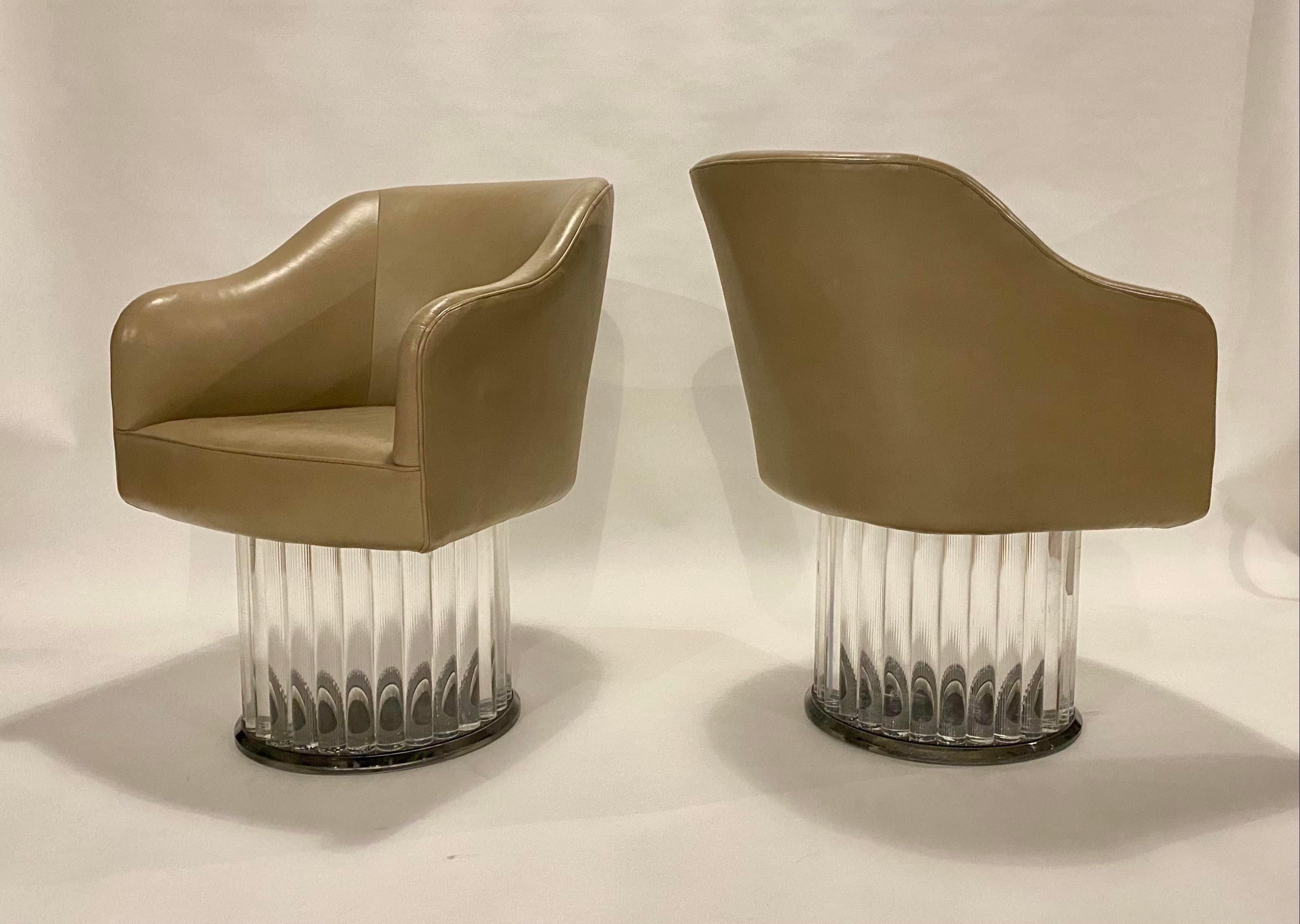 Pair of Space Age Swivel Arm Chairs on Lucite Base and Taupe Leather In Good Condition In Chicago, IL