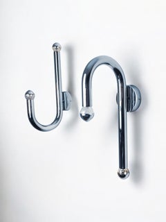 Pair of space-age tubular wall lights, chromed metal, Italy, 1970