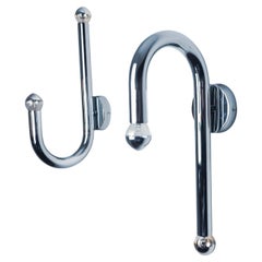 Pair of space-age tubular wall lights, chromed metal, Italy, 1970