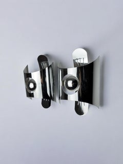 Pair of space age wall lights, chromed metal, Italy, 1970