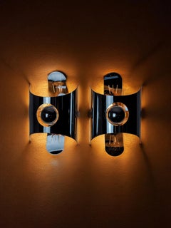 Pair of space age wall lights, chromed metal, Italy, 1970