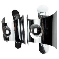 Pair of space age wall lights, chromed metal, Italy, 1970
