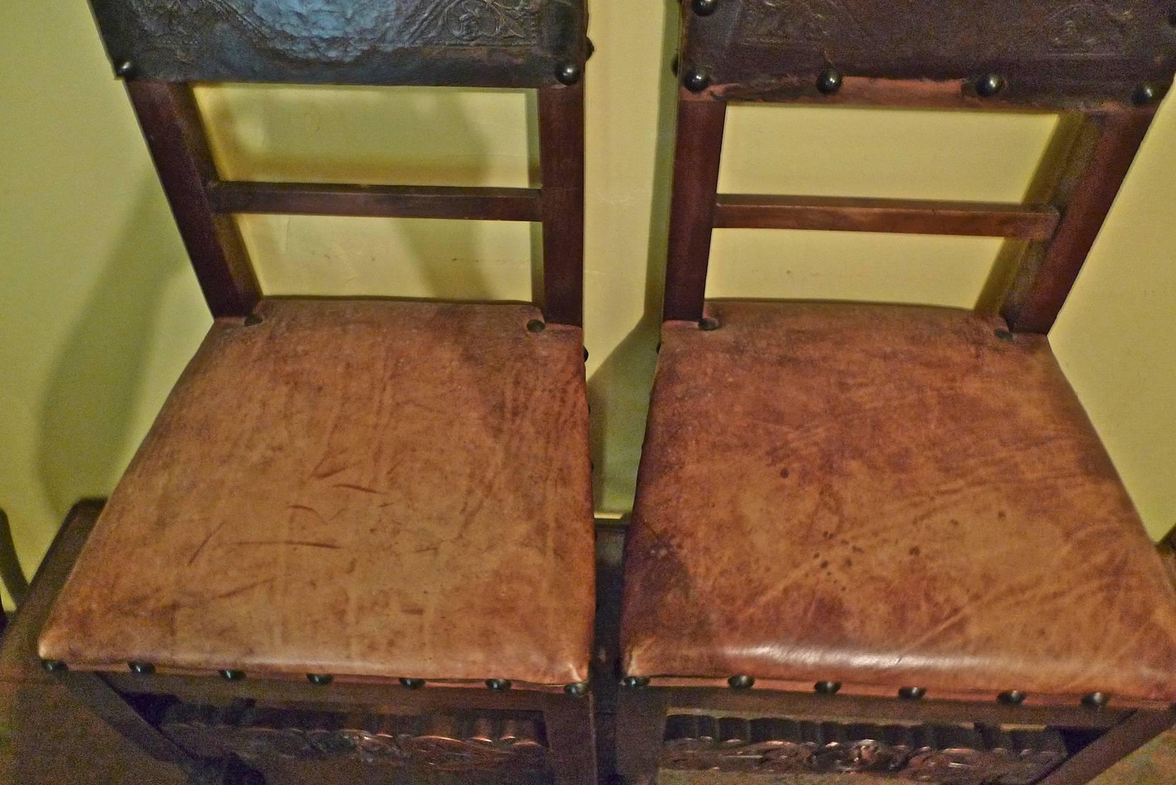 Pair of Spanish 18th Century High Back Studded Leather Dining Chairs In Distressed Condition In Santa Monica, CA