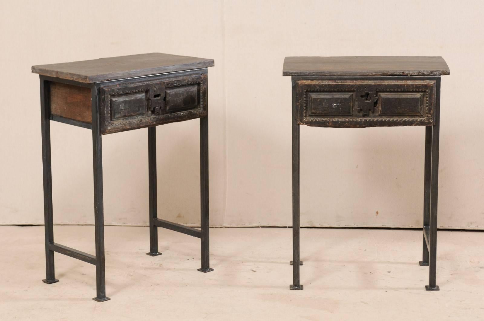 A pair of unique 18th century Spanish single drawer tables. This pair of 18th century (or earlier) Spanish drawers have been re-imagined and set into a custom iron base and older wood tops to produce this fantastic pair of statement pieces. The