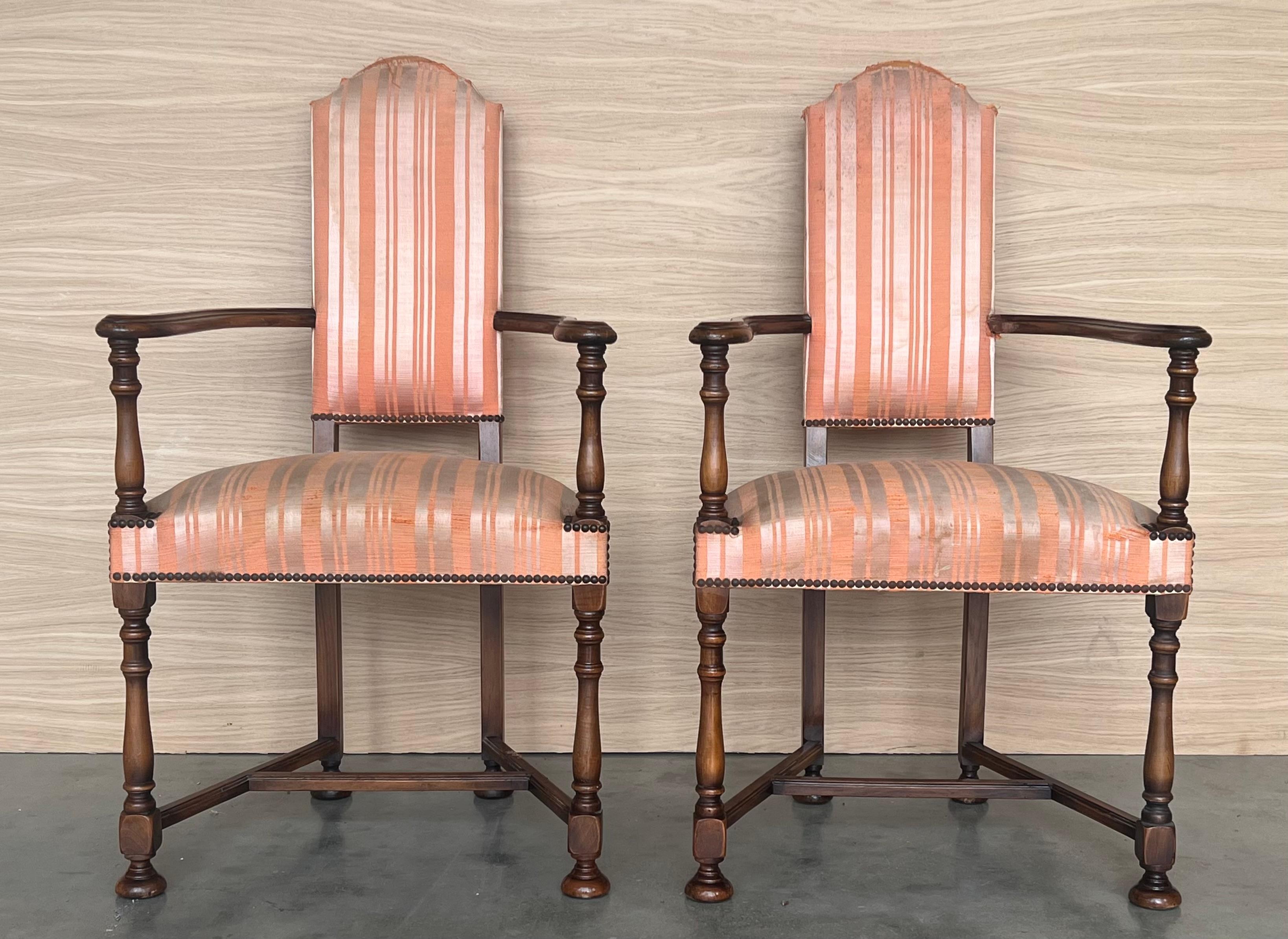 Pair of Spanish Armchairs with High Back signed by Valenti

The fabric is dirty and needs a reupholstered.